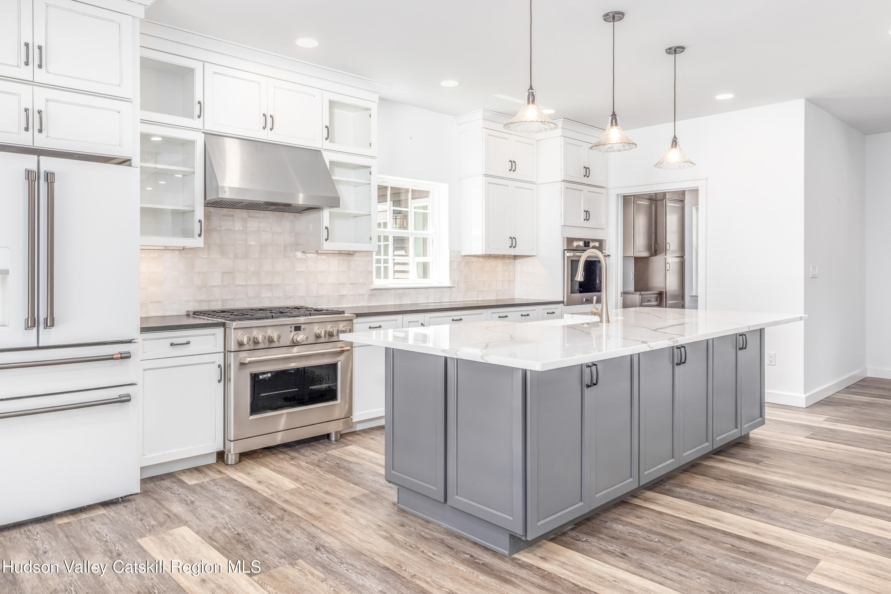 621 Decker Road Wallkill, NY 12589 - Photo 12 of 44 a kitchen with stainless steel appliances and white cabinets