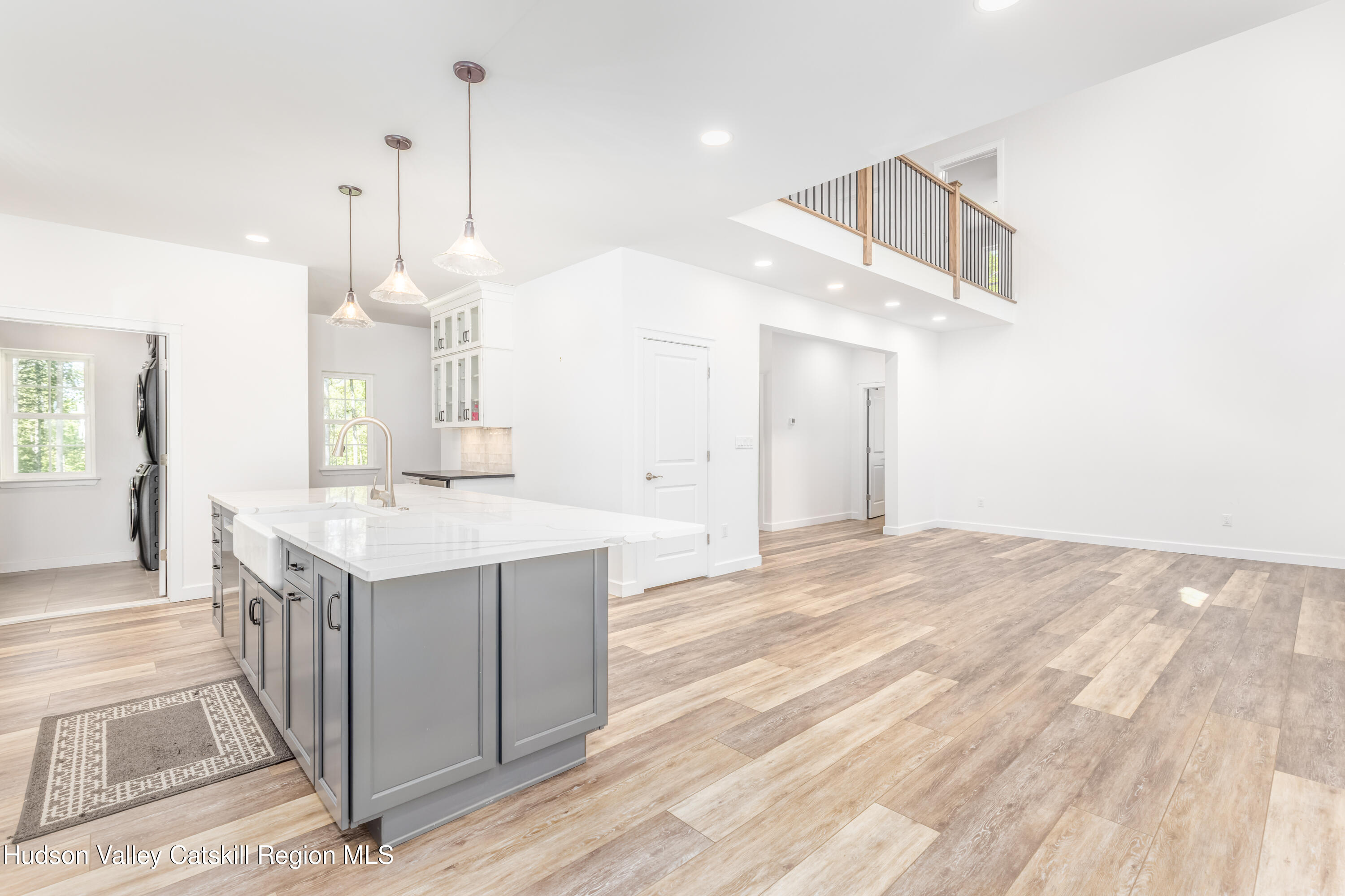 621 Decker Road Wallkill, NY 12589 - Photo 14 of 44 a kitchen with a sink a stove and a wooden floor
