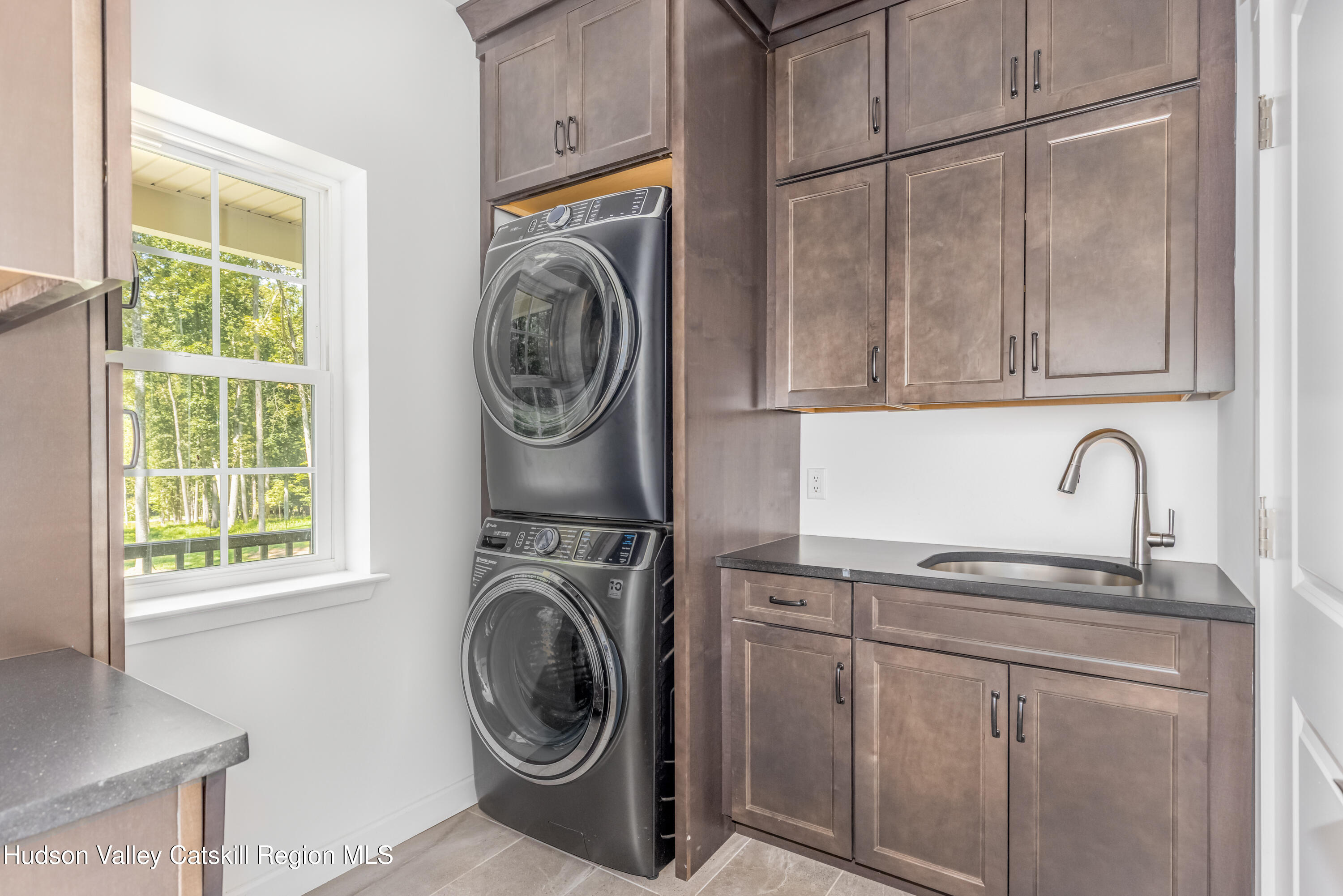 621 Decker Road Wallkill, NY 12589 - Photo 17 of 44 a utility room with sink dryer and washer