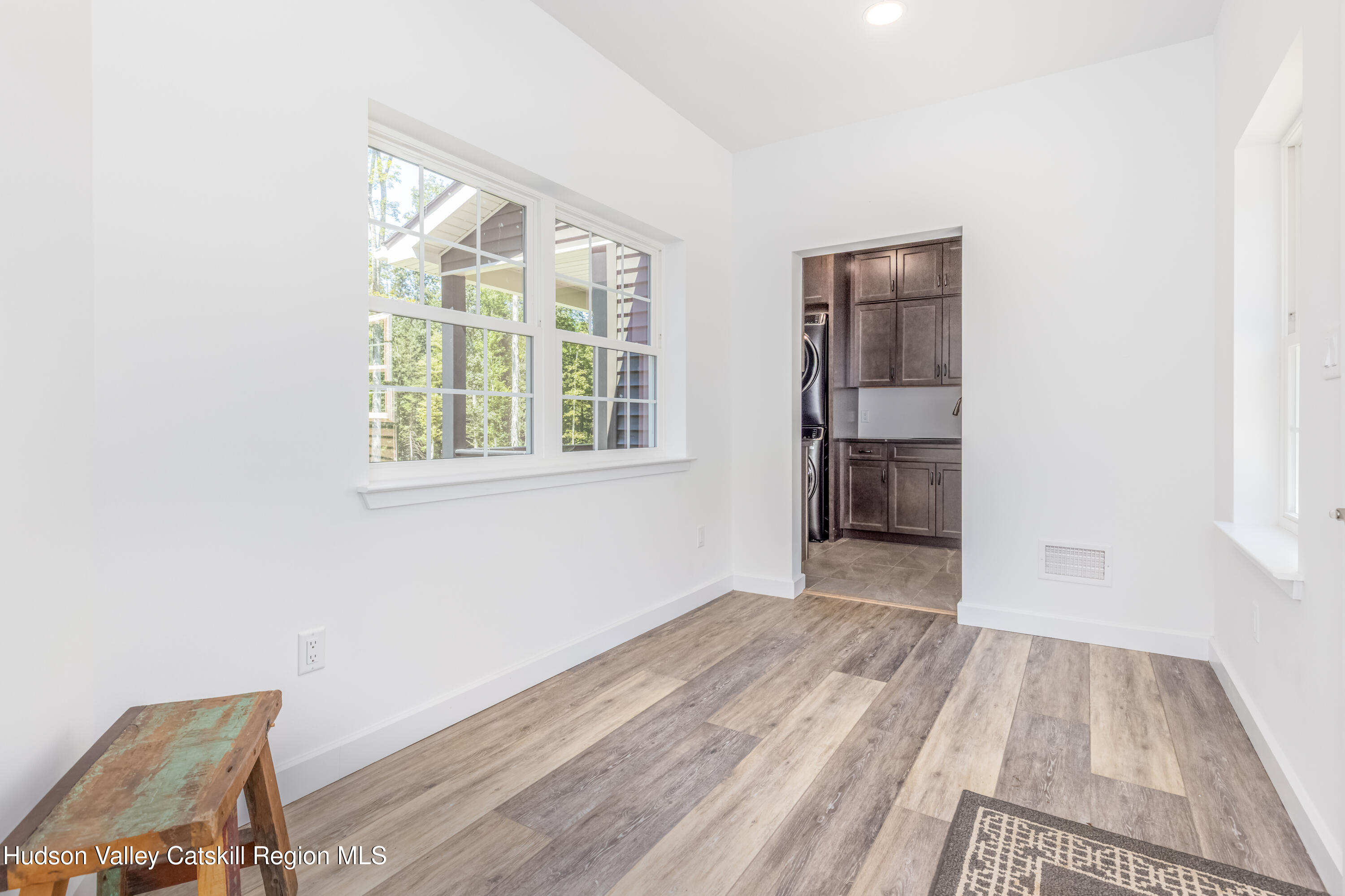 621 Decker Road Wallkill, NY 12589 - Photo 18 of 44 a view of an empty room with wooden floor and a window