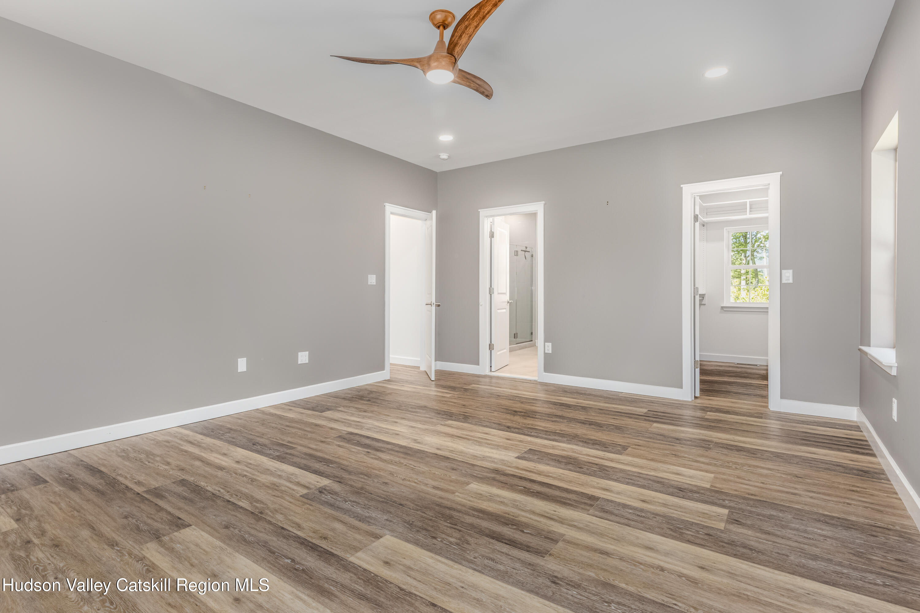 621 Decker Road Wallkill, NY 12589 - Photo 20 of 44 a view of an empty room with window and wooden floor