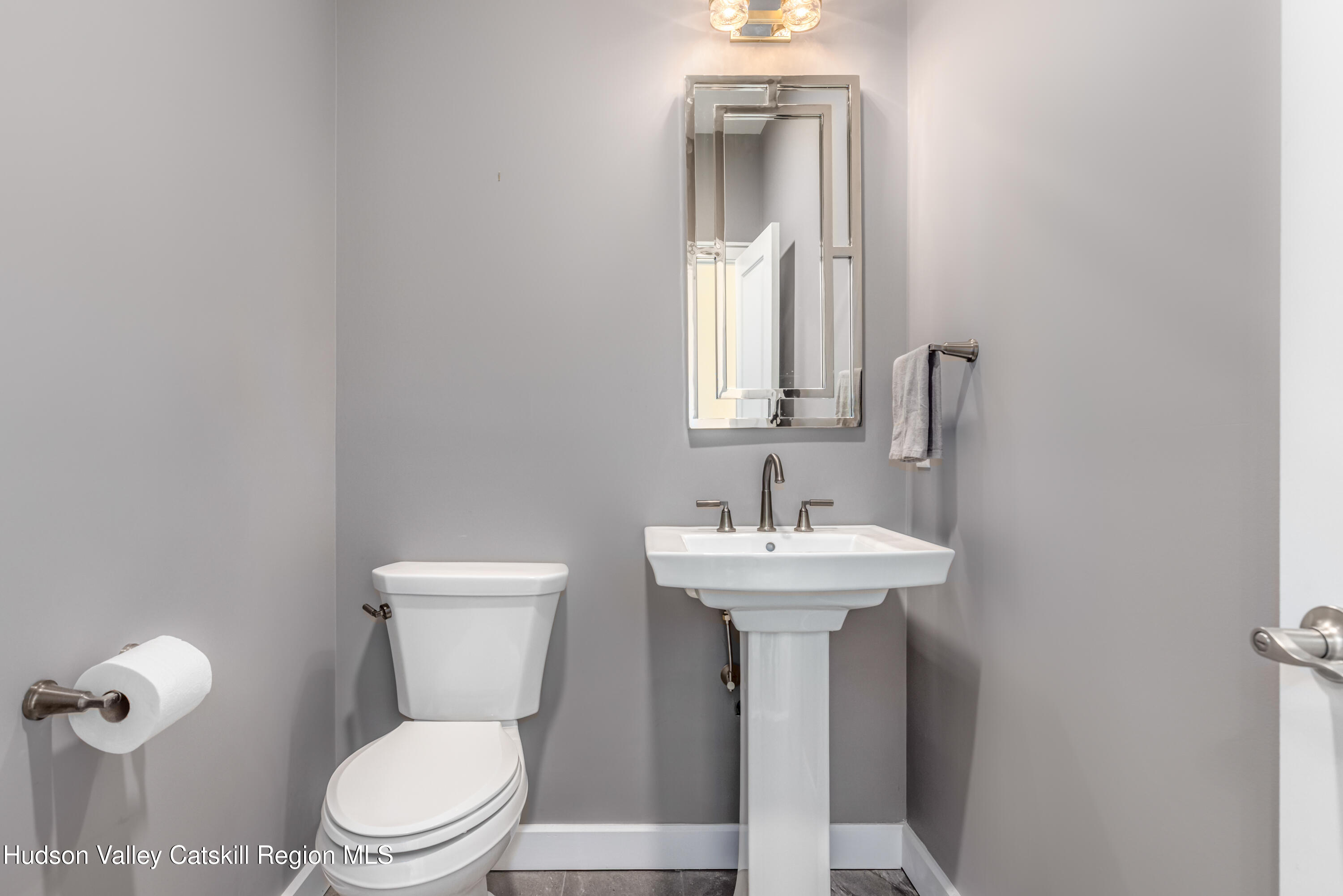 621 Decker Road Wallkill, NY 12589 - Photo 24 of 44 a bathroom with a toilet sink and mirror