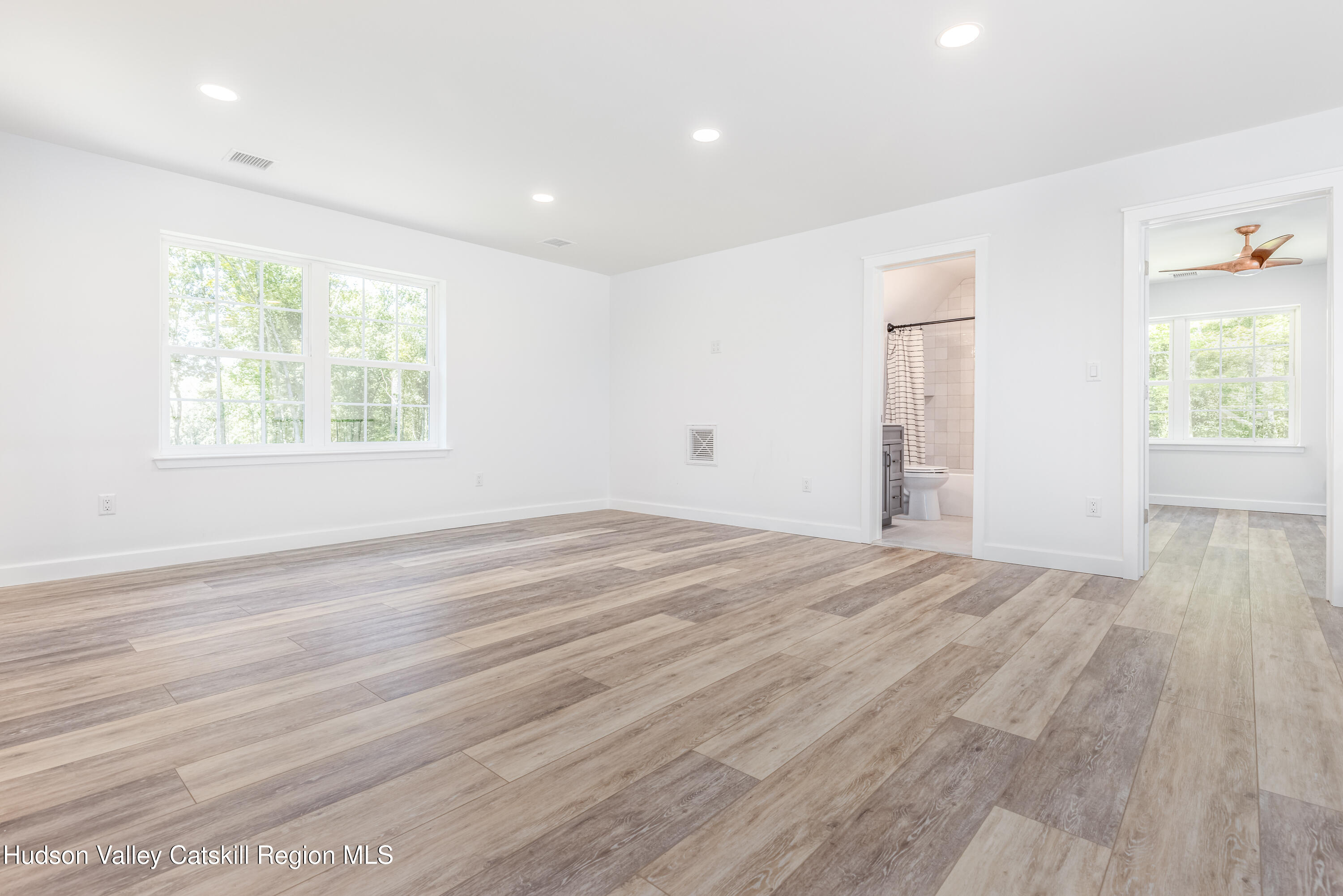 621 Decker Road Wallkill, NY 12589 - Photo 28 of 44 a view of empty room with wooden floor and fan