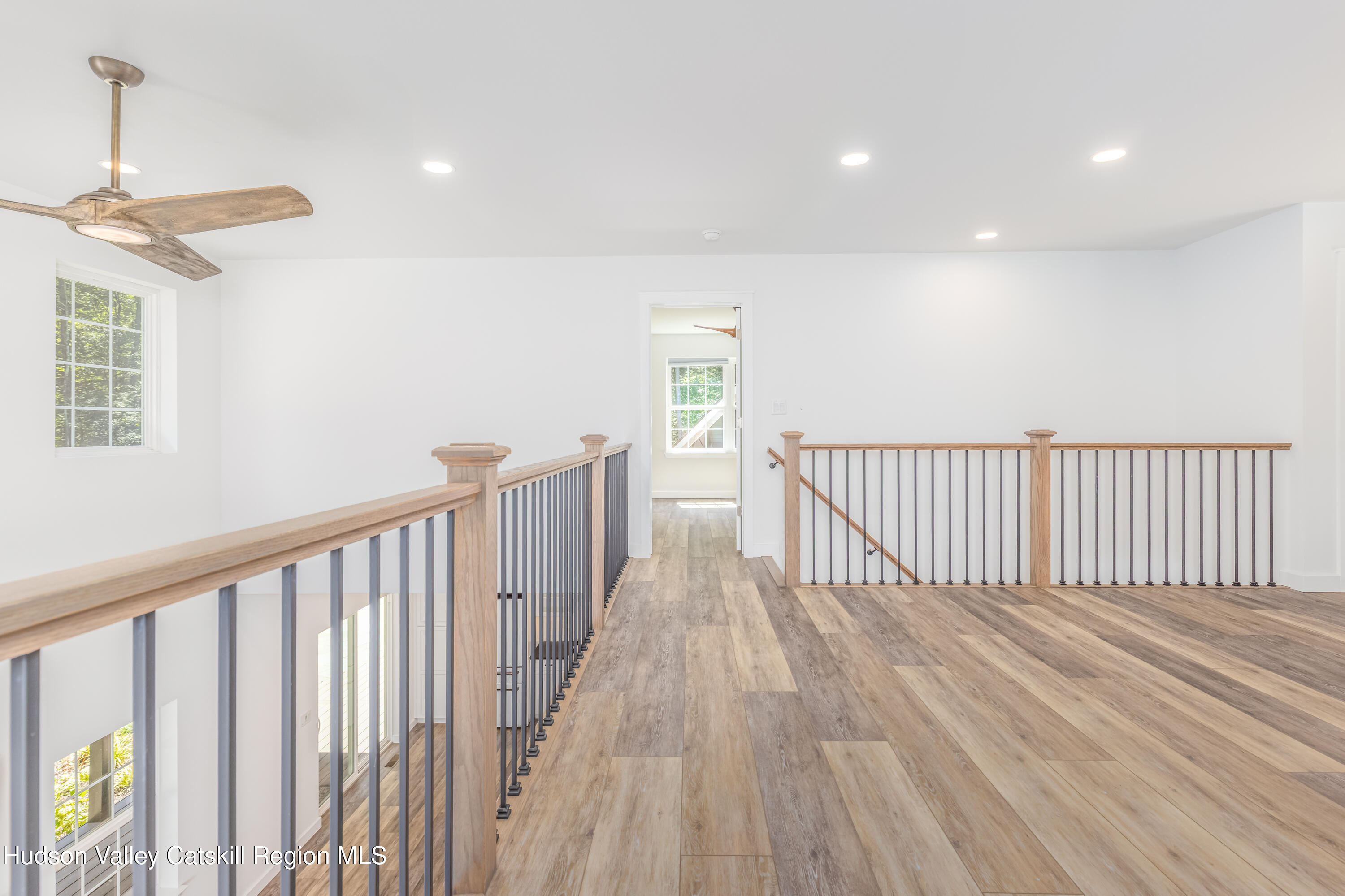 621 Decker Road Wallkill, NY 12589 - Photo 29 of 44 a view of a hallway with wooden floor and staircase