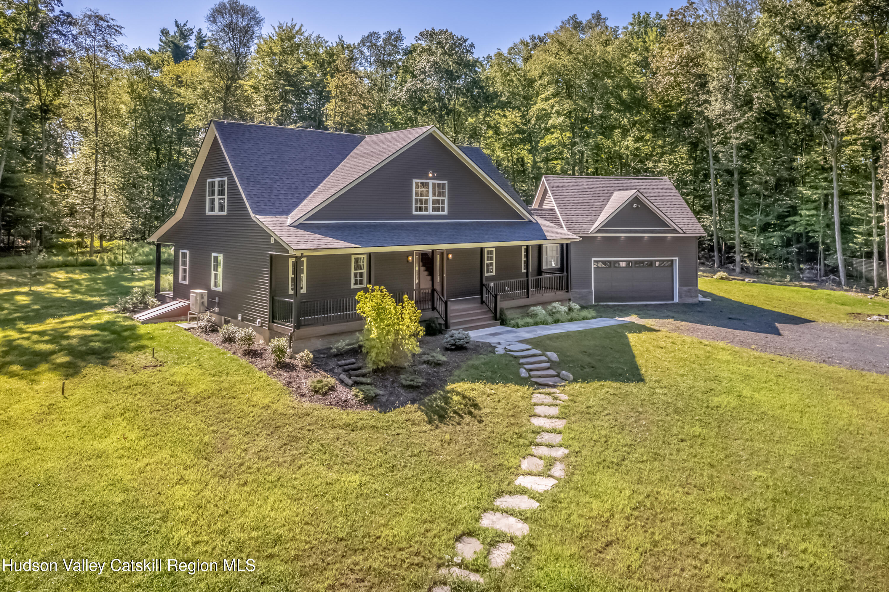 621 Decker Road Wallkill, NY 12589 - Photo 3 of 44 a front view of a house with swimming pool yard and outdoor seating