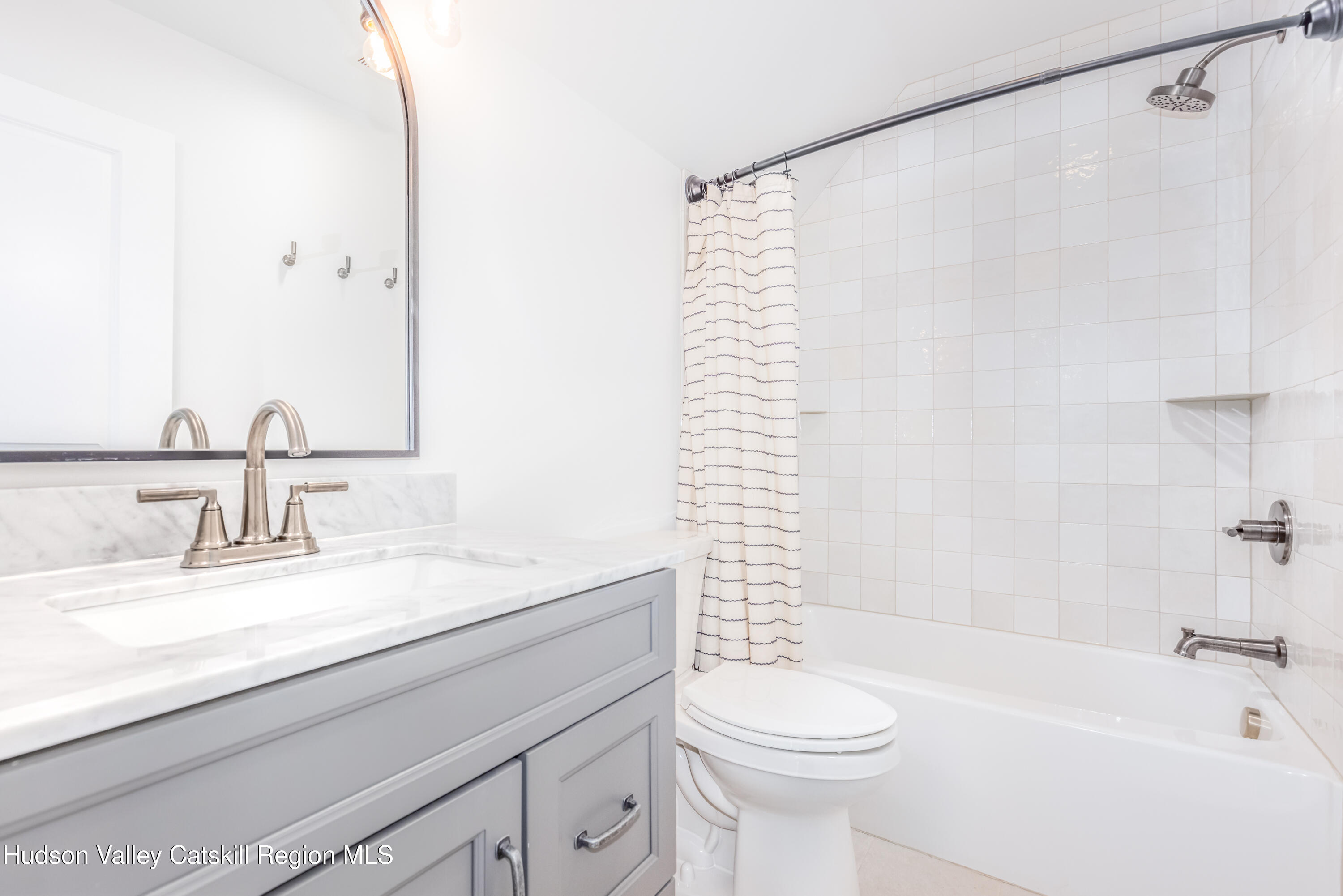 621 Decker Road Wallkill, NY 12589 - Photo 36 of 44 a bathroom with a sink a toilet and a bathtub