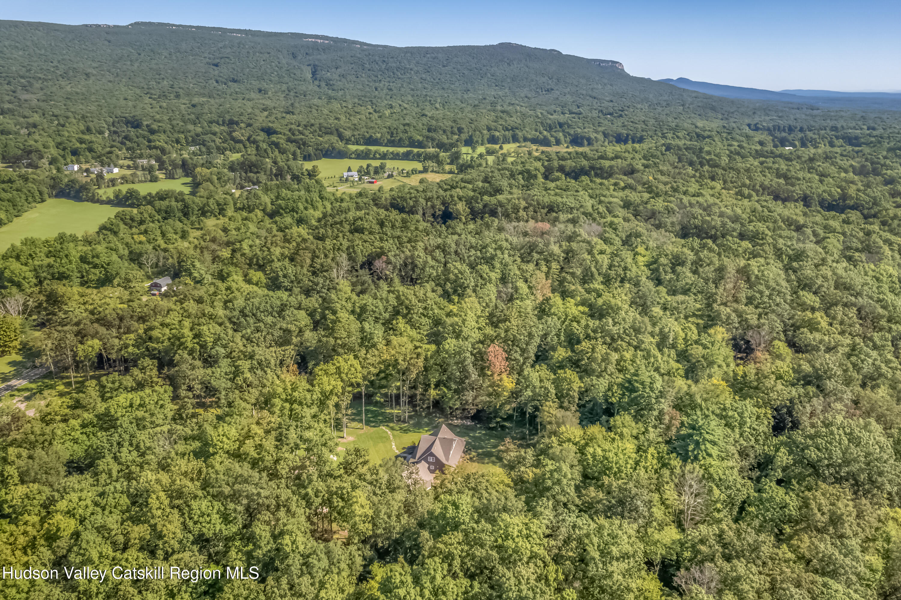 621 Decker Road Wallkill, NY 12589 - Photo 5 of 44 a view of a lush green hillside and a building