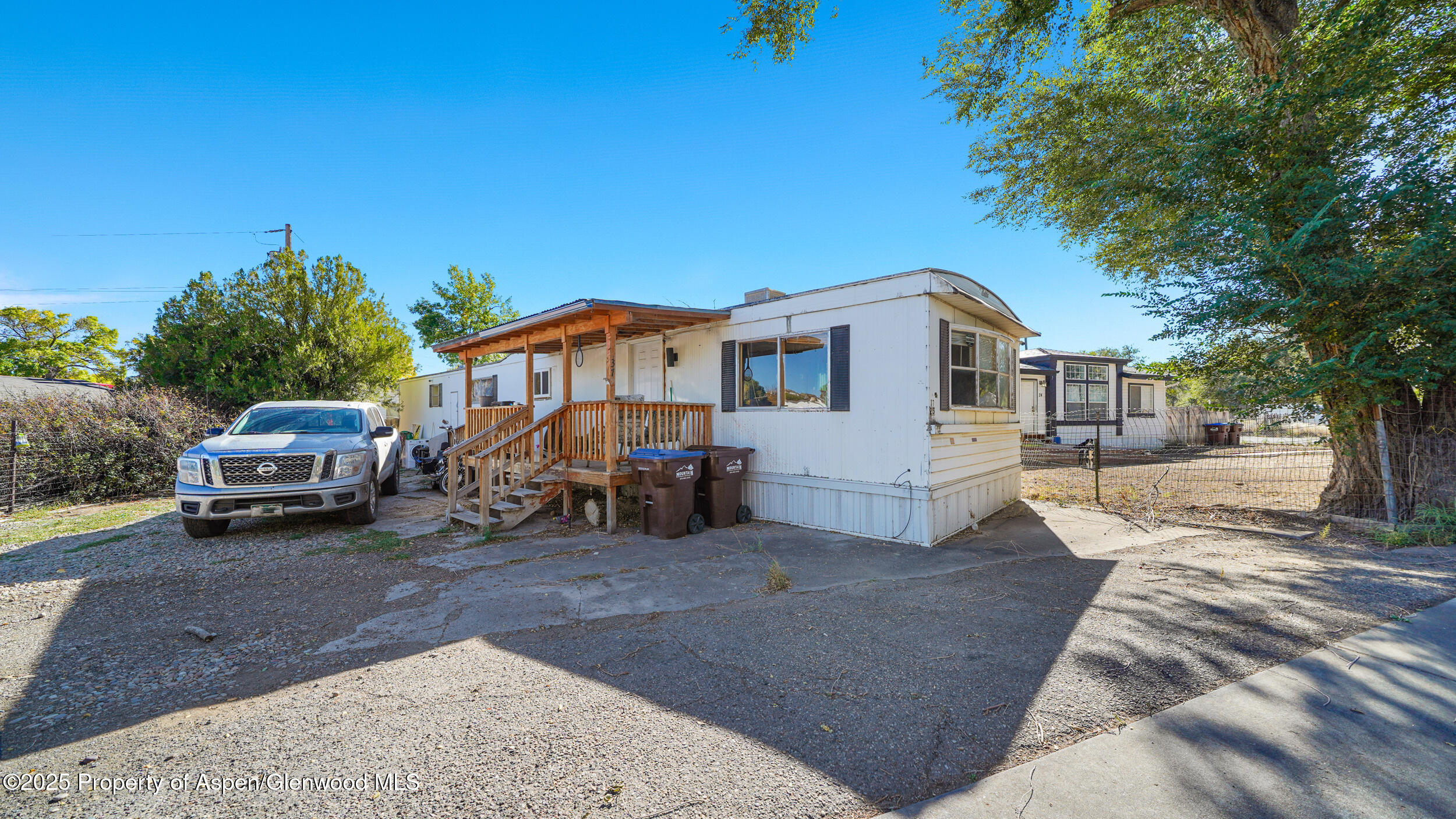 1501 Railroad Avenue, Unit 37 Rifle, CO 81650 - Photo 2 of 18 a view of a car park in front of house