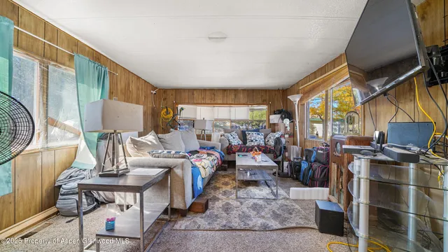 a living room with lots of furniture and a fireplace