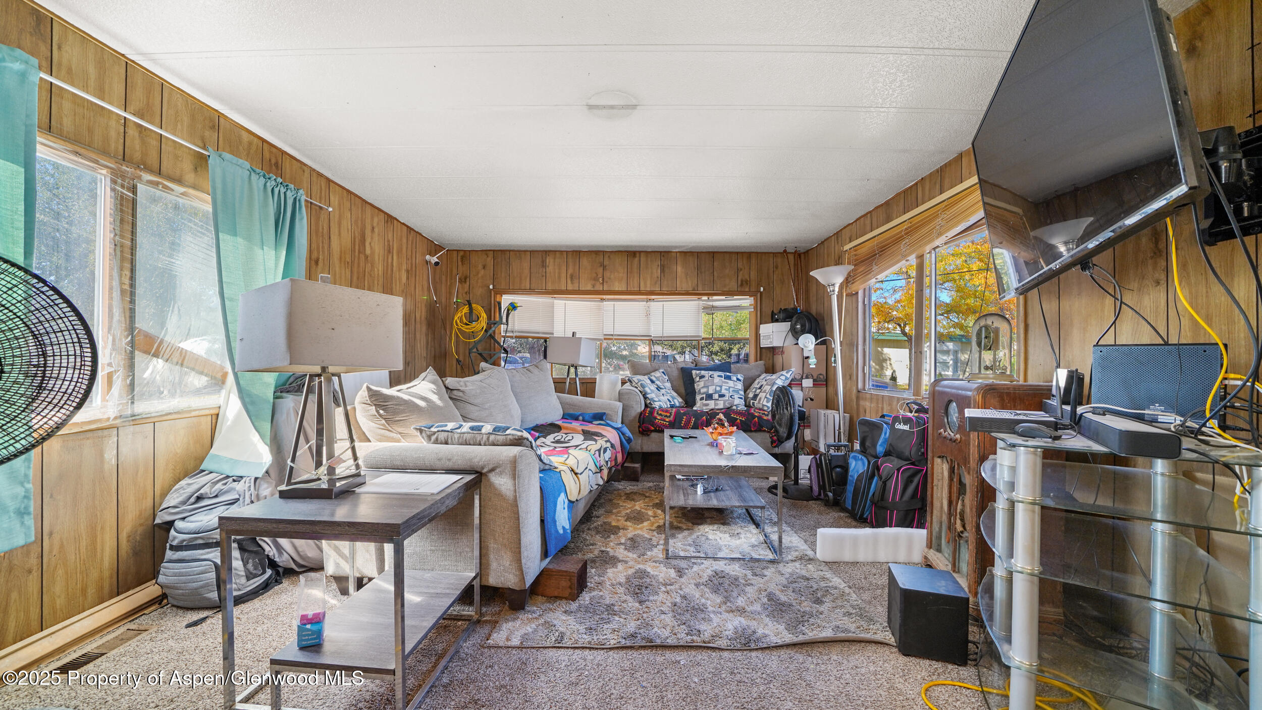 1501 Railroad Avenue, Unit 37 Rifle, CO 81650 - Photo 4 of 18 a living room with lots of furniture and a fireplace