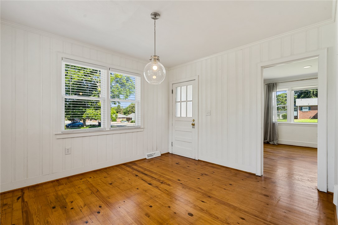 419 Whitehall Road Anderson, SC 29625 - Photo 8 of 28 Natural light floods this charming room with rich hardwood floors, perfect for any use.