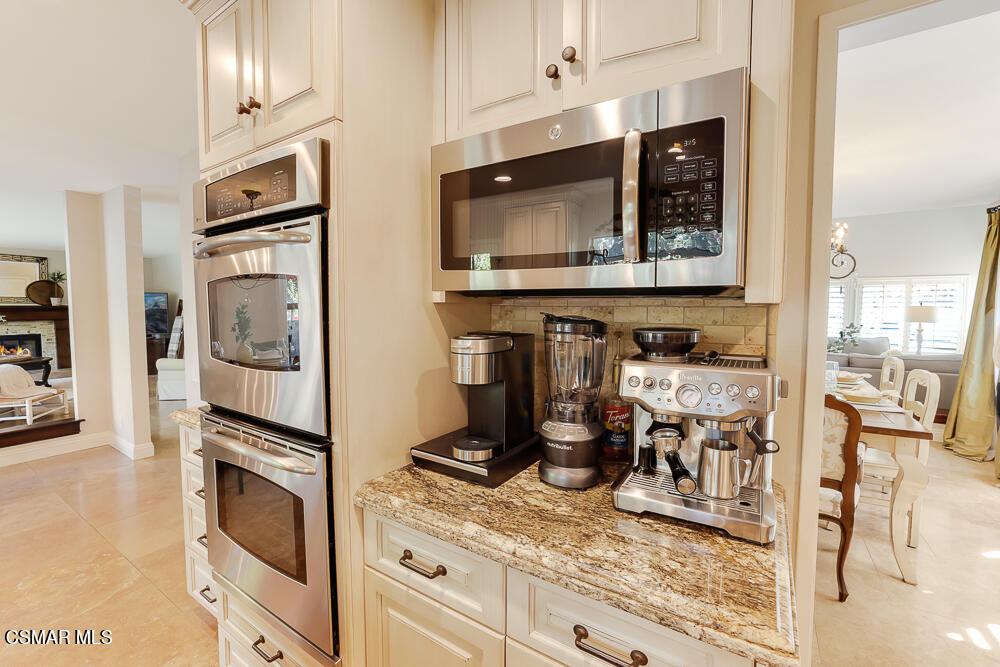 4051 Doneva Road Moorpark, CA 93021 - Photo 12 of 52 a kitchen with granite countertop stainless steel appliances and a counter space