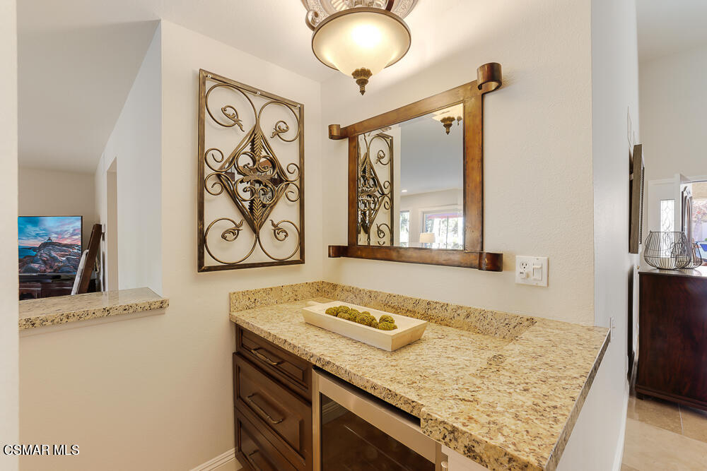 4051 Doneva Road Moorpark, CA 93021 - Photo 17 of 52 a bathroom with a granite countertop sink and a mirror