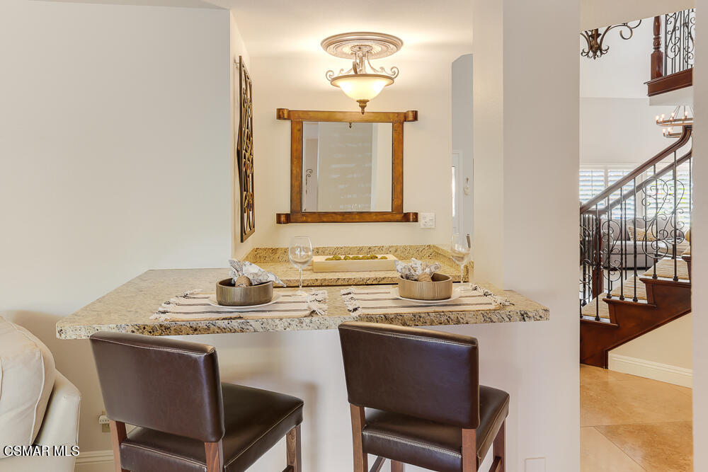 4051 Doneva Road Moorpark, CA 93021 - Photo 18 of 52 a dining room with a sink and a mirror