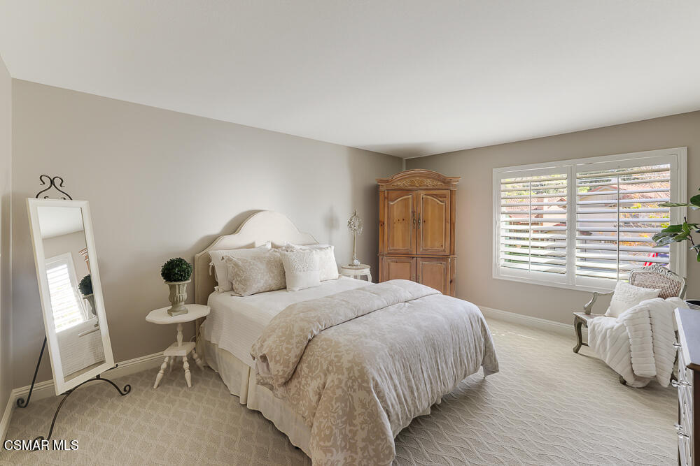 4051 Doneva Road Moorpark, CA 93021 - Photo 27 of 52 a bedroom with a bed and wooden floor
