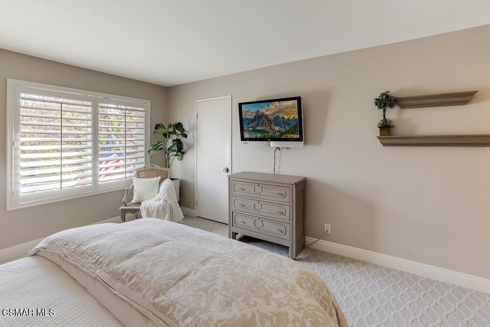 4051 Doneva Road Moorpark, CA 93021 - Photo 29 of 52 a bedroom with a bed and a flat screen tv