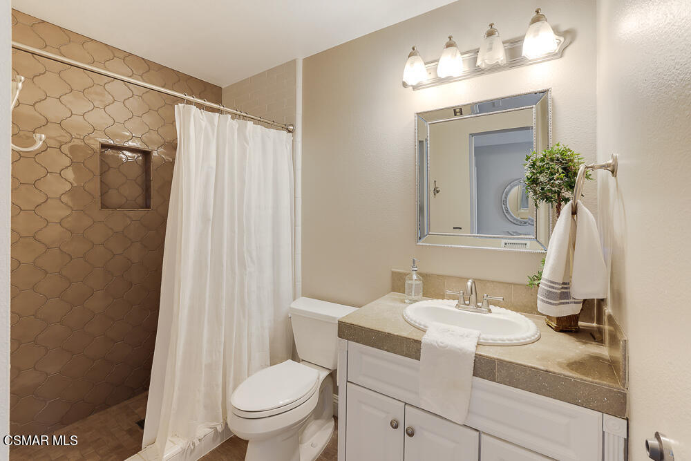 4051 Doneva Road Moorpark, CA 93021 - Photo 30 of 52 a bathroom with a sink toilet and shower