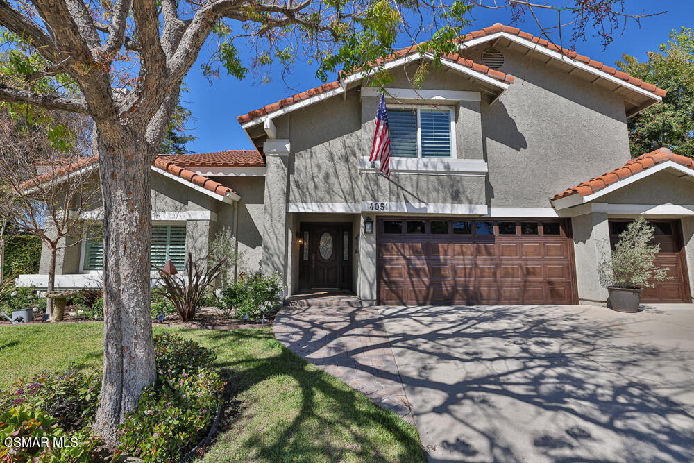 4051 Doneva Road Moorpark, CA 93021 - Photo 3 of 52 a front view of a house with a yard