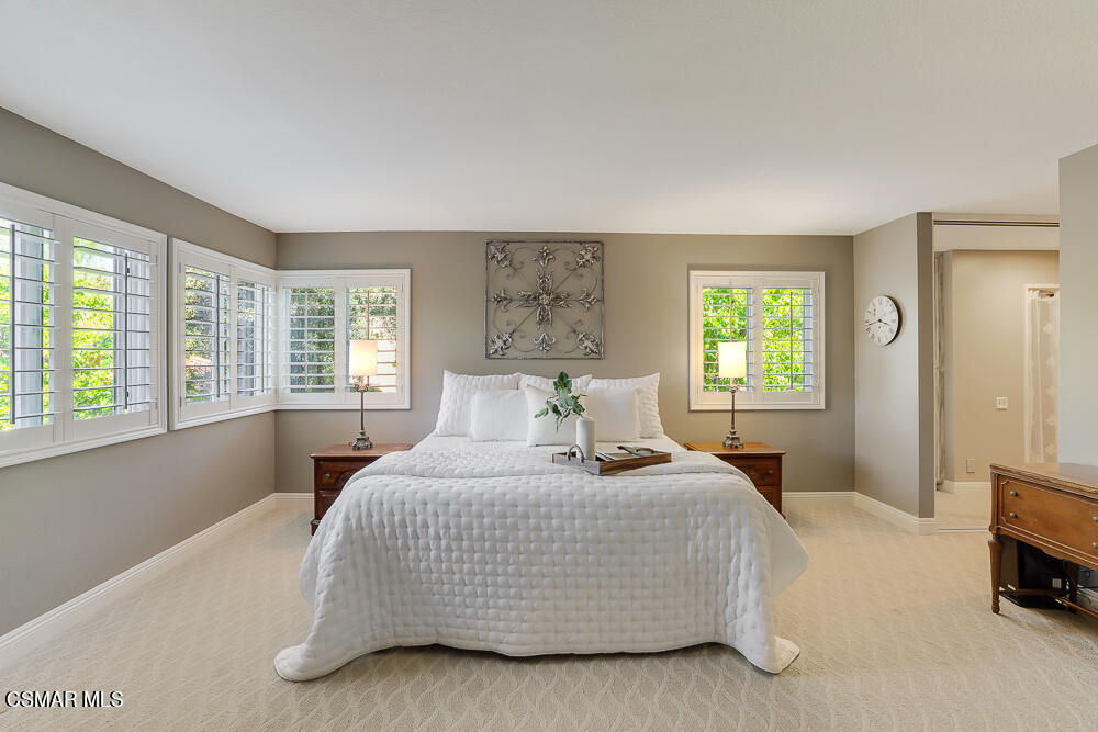 4051 Doneva Road Moorpark, CA 93021 - Photo 32 of 52 a bedroom with a bed a table and a window