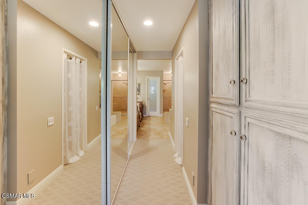 4051 Doneva Road Moorpark, CA 93021 - Photo 34 of 52 a view of a hallway with wooden shelves