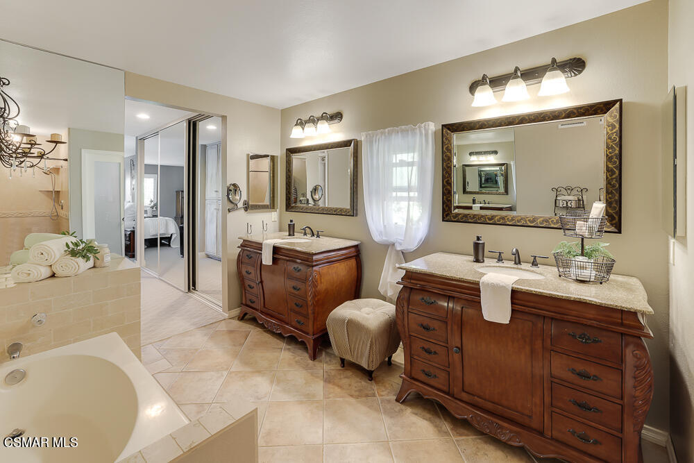 4051 Doneva Road Moorpark, CA 93021 - Photo 36 of 52 a spacious bathroom with a double vanity sink mirror and bathtub