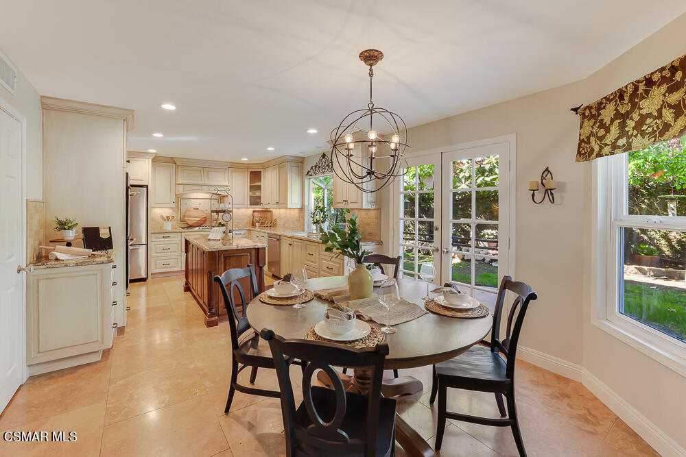 4051 Doneva Road Moorpark, CA 93021 - Photo 9 of 52 a view of a dining room with furniture a chandelier and wooden floor