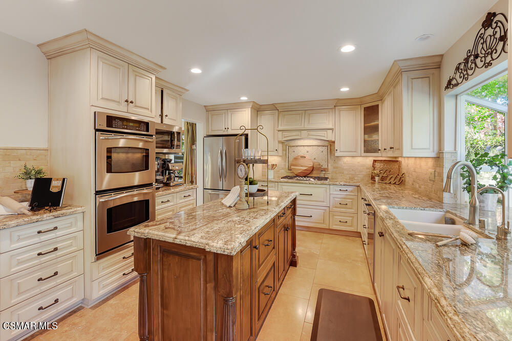 4051 Doneva Road Moorpark, CA 93021 - Photo 10 of 52 a kitchen with a sink stove and refrigerator