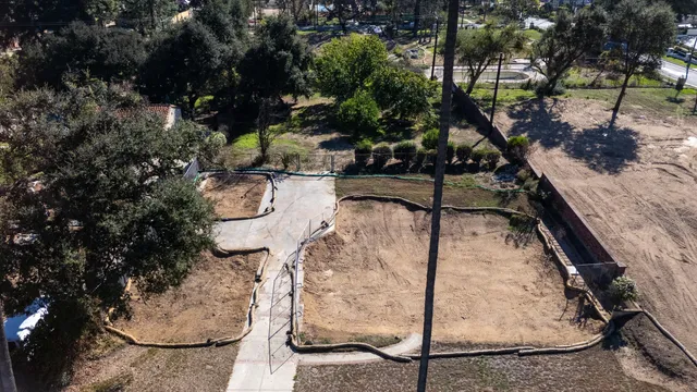 a view of a backyard with sitting area