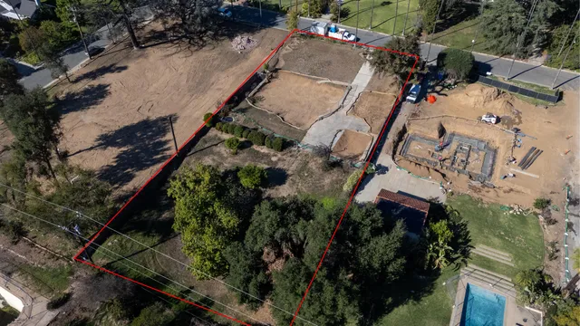 an aerial view of residential house with outdoor space