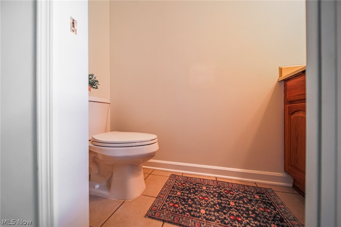 9554 Dover Road Apple Creek, OH 44606 - Photo 34 of 45 Bathroom with baseboards and light tile patterned floors