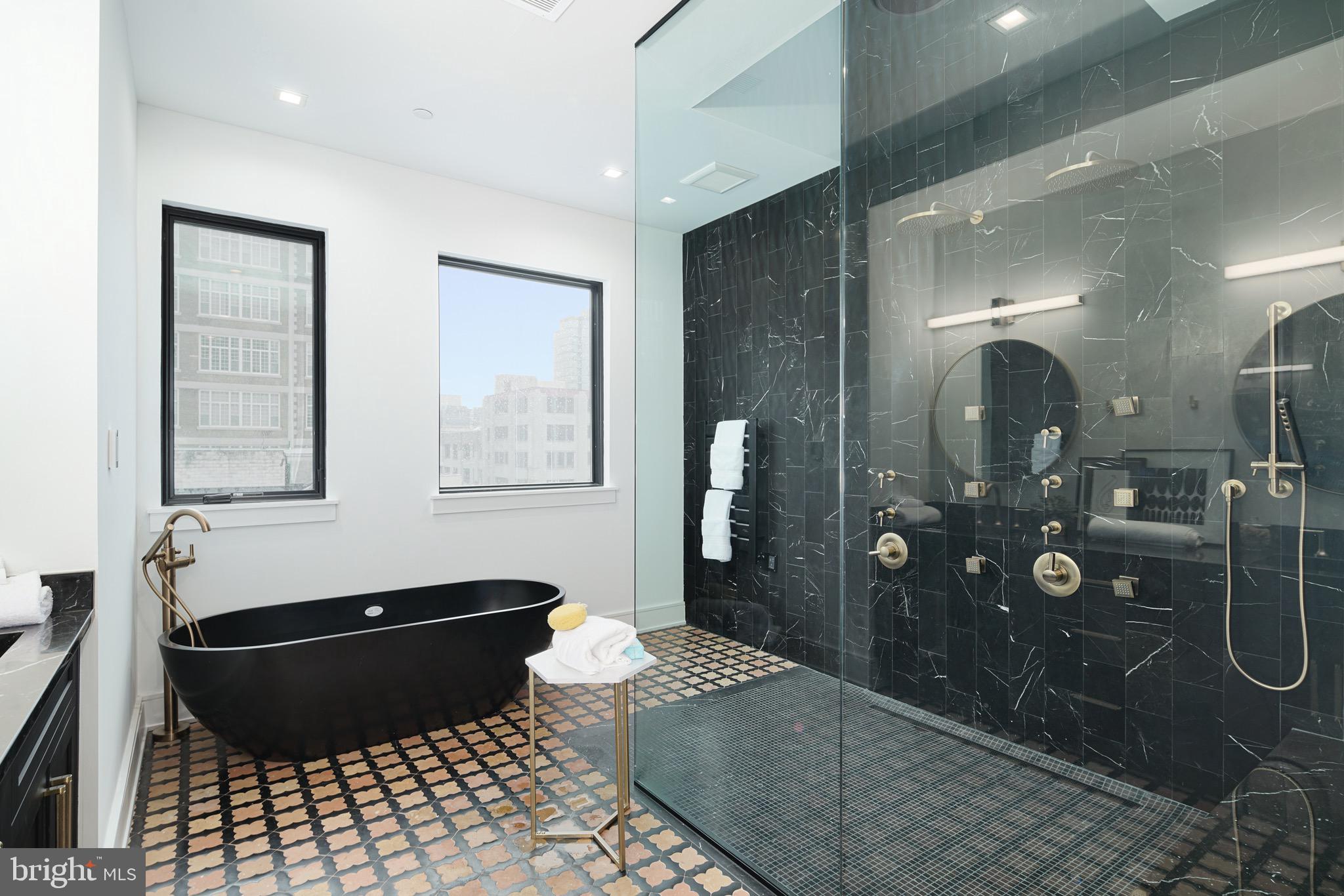 2322 Sansom Street Philadelphia, PA 19103 - Photo 54 of 82 rimary Bathroom Shower w/ 13' Ceiling & Skylight