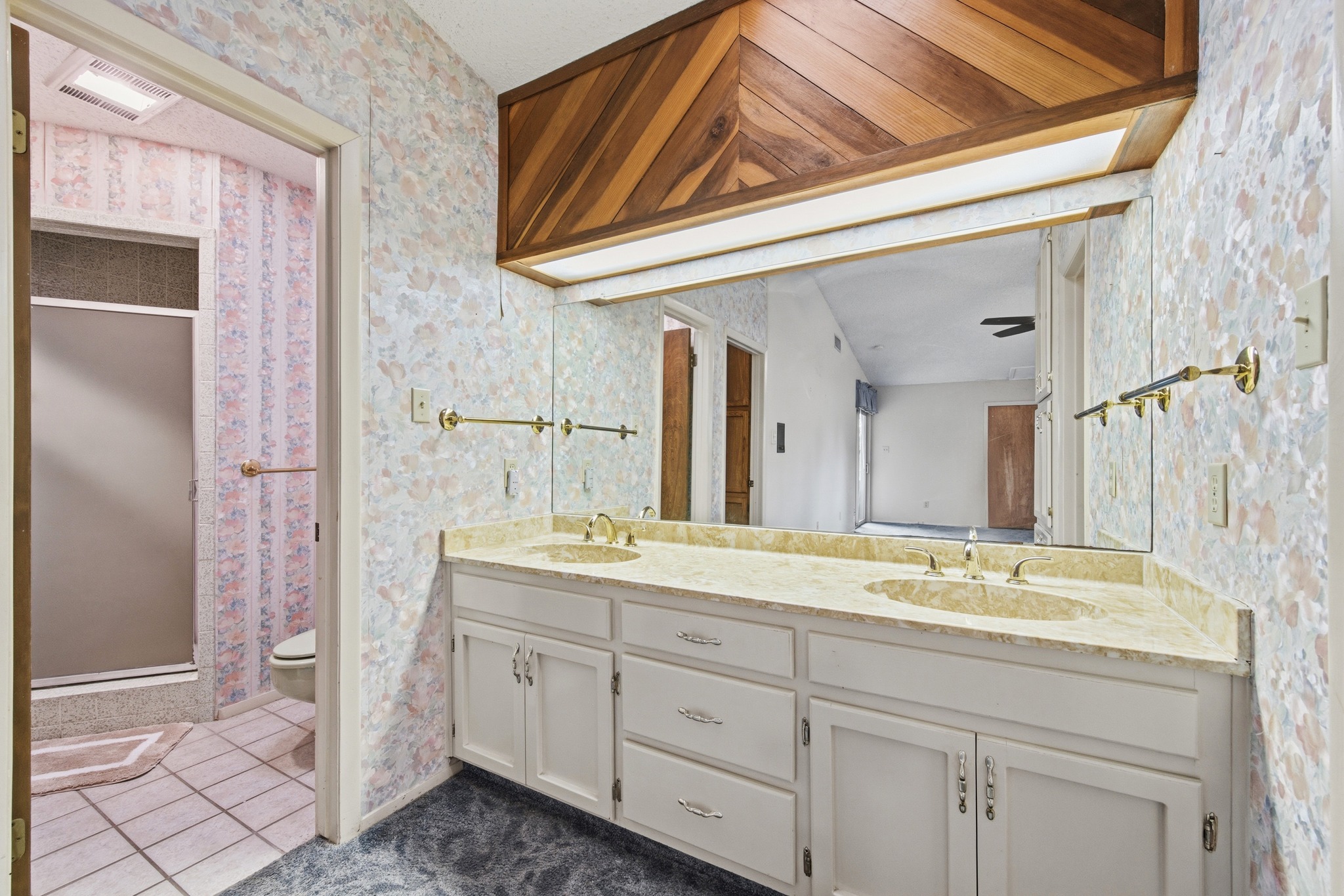 4831 Eck Lane Austin, TX 78734 - Photo 18 of 27 a bathroom with a granite countertop sink and a mirror