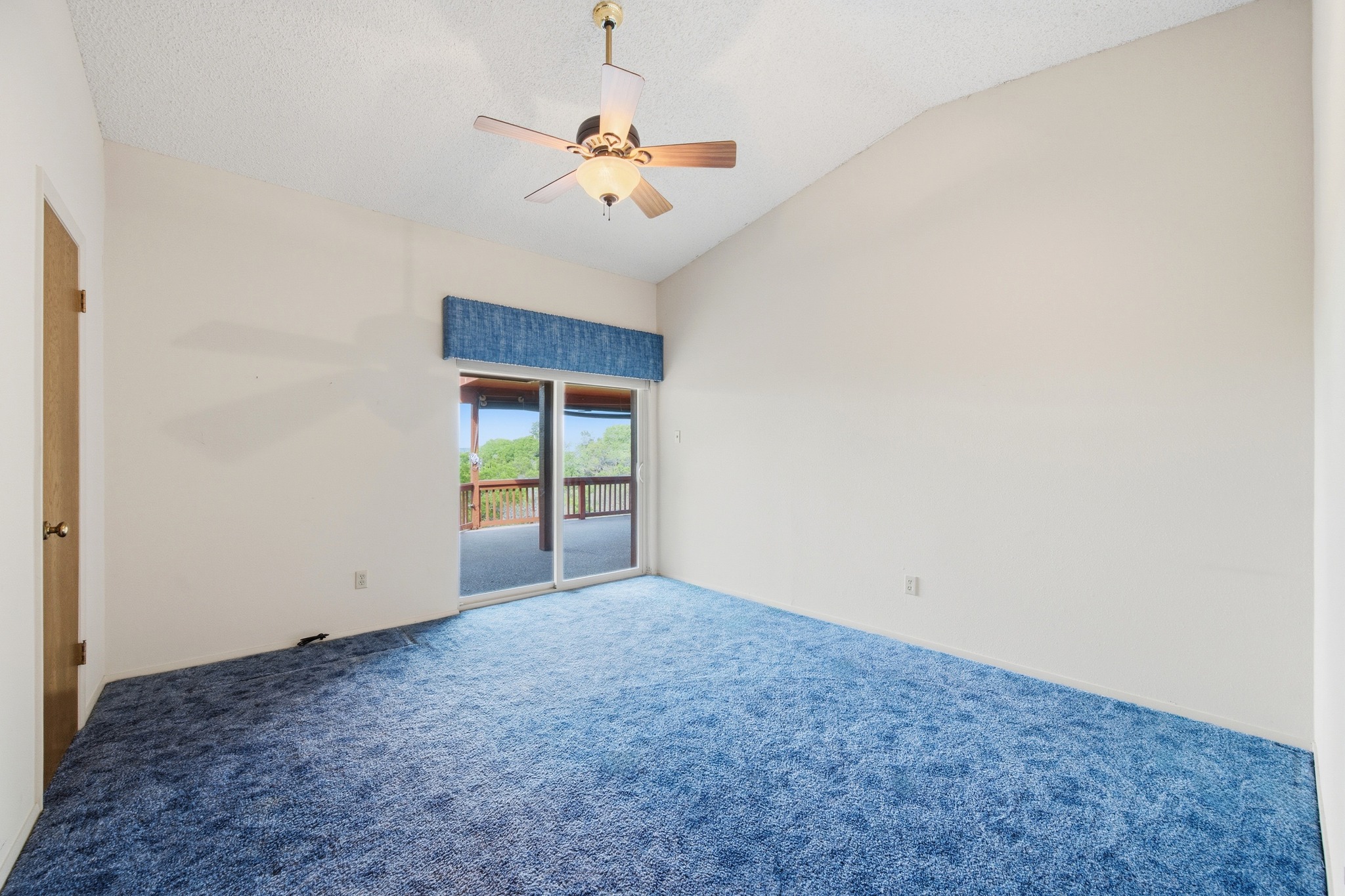 4831 Eck Lane Austin, TX 78734 - Photo 19 of 27 a view of an empty room with a chandelier fan