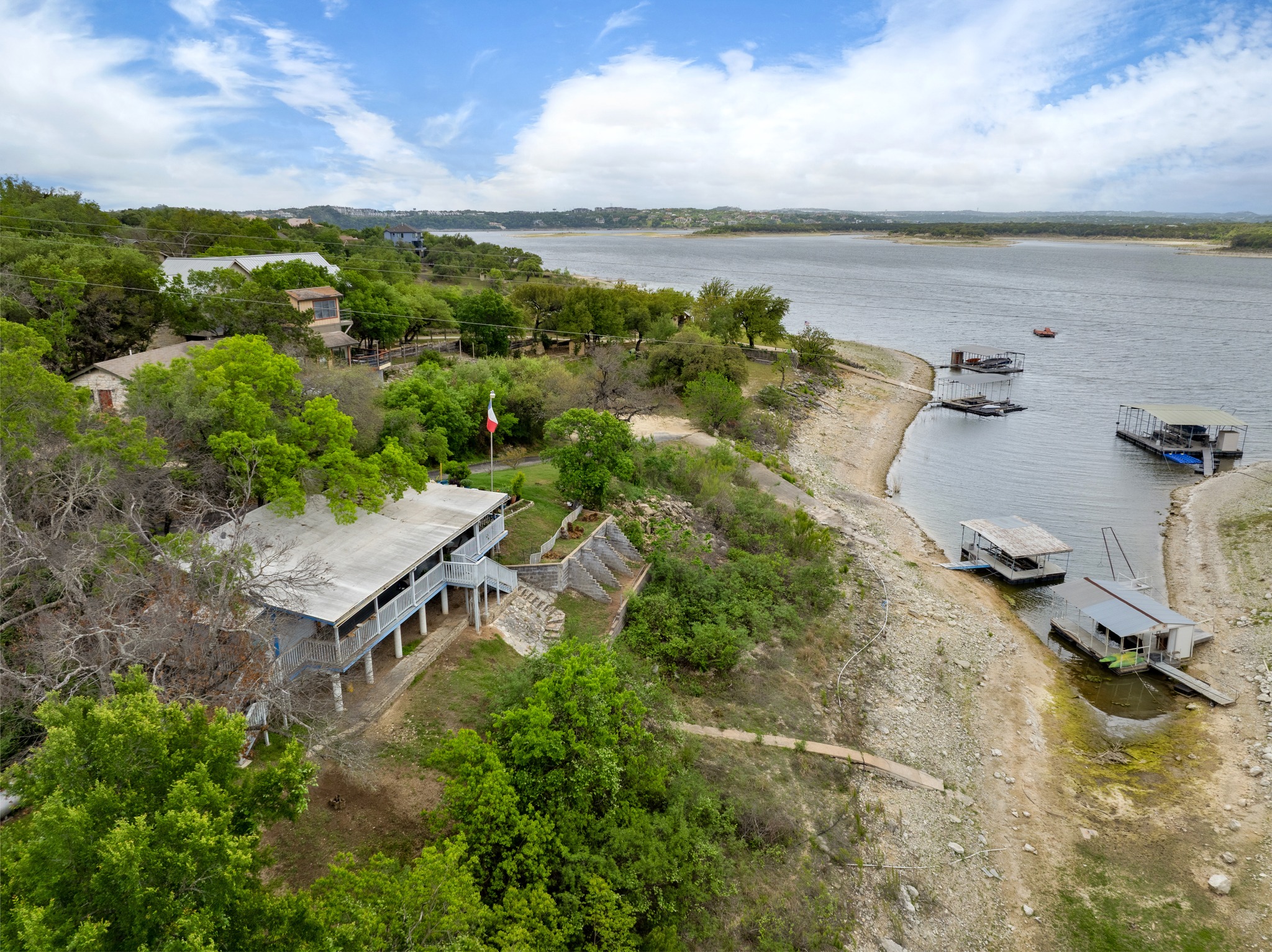 4831 Eck Lane Austin, TX 78734 - Photo 26 of 27 an aerial view of a house with a lake view