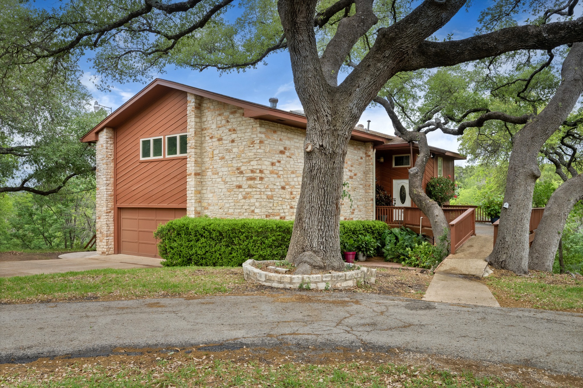 4831 Eck Lane Austin, TX 78734 - Photo 5 of 27 a front view of a house with a yard and garage