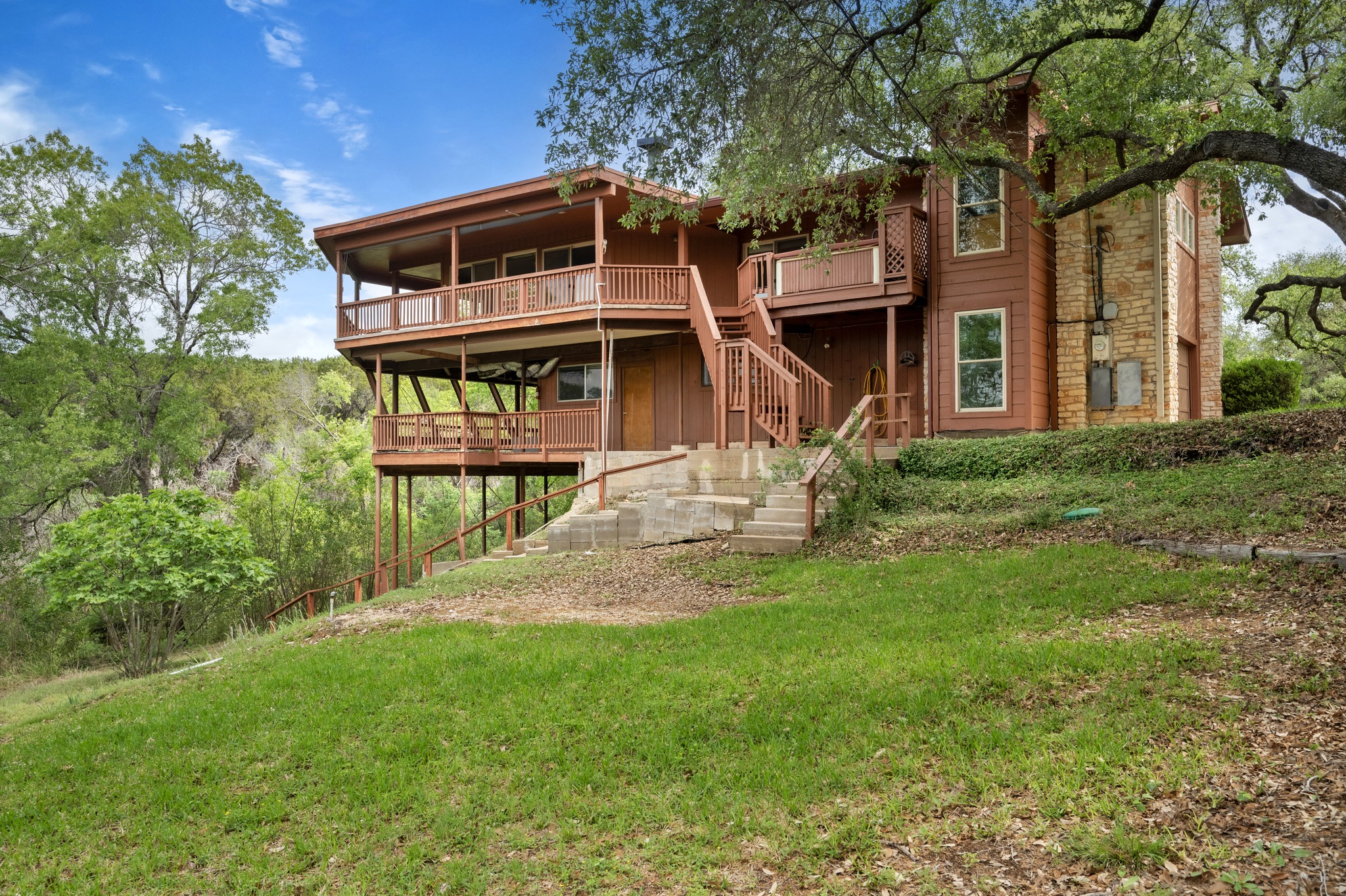 4831 Eck Lane Austin, TX 78734 - Photo 8 of 27 a front view of a house with a yard