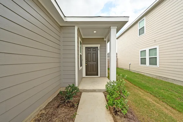 a view of house with backyard