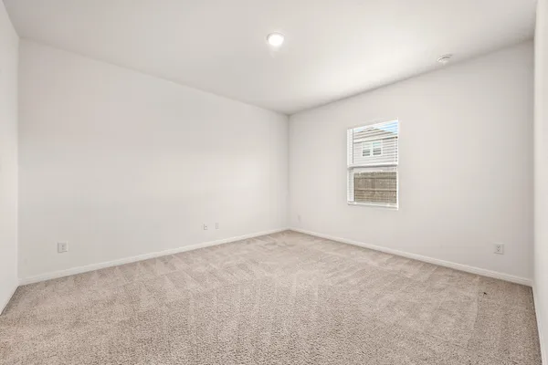 a kitchen with granite countertop white cabinets and stainless steel appliances