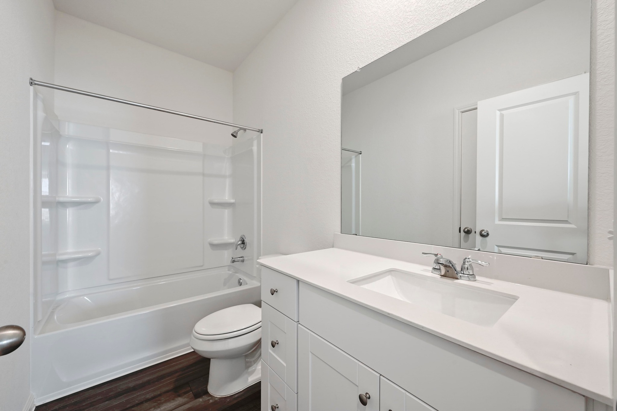 473 Thistle Lane Maxwell, TX 78656 - Photo 19 of 25 Full bathroom with vanity, shower / bath combination, and dark wood-style flooring