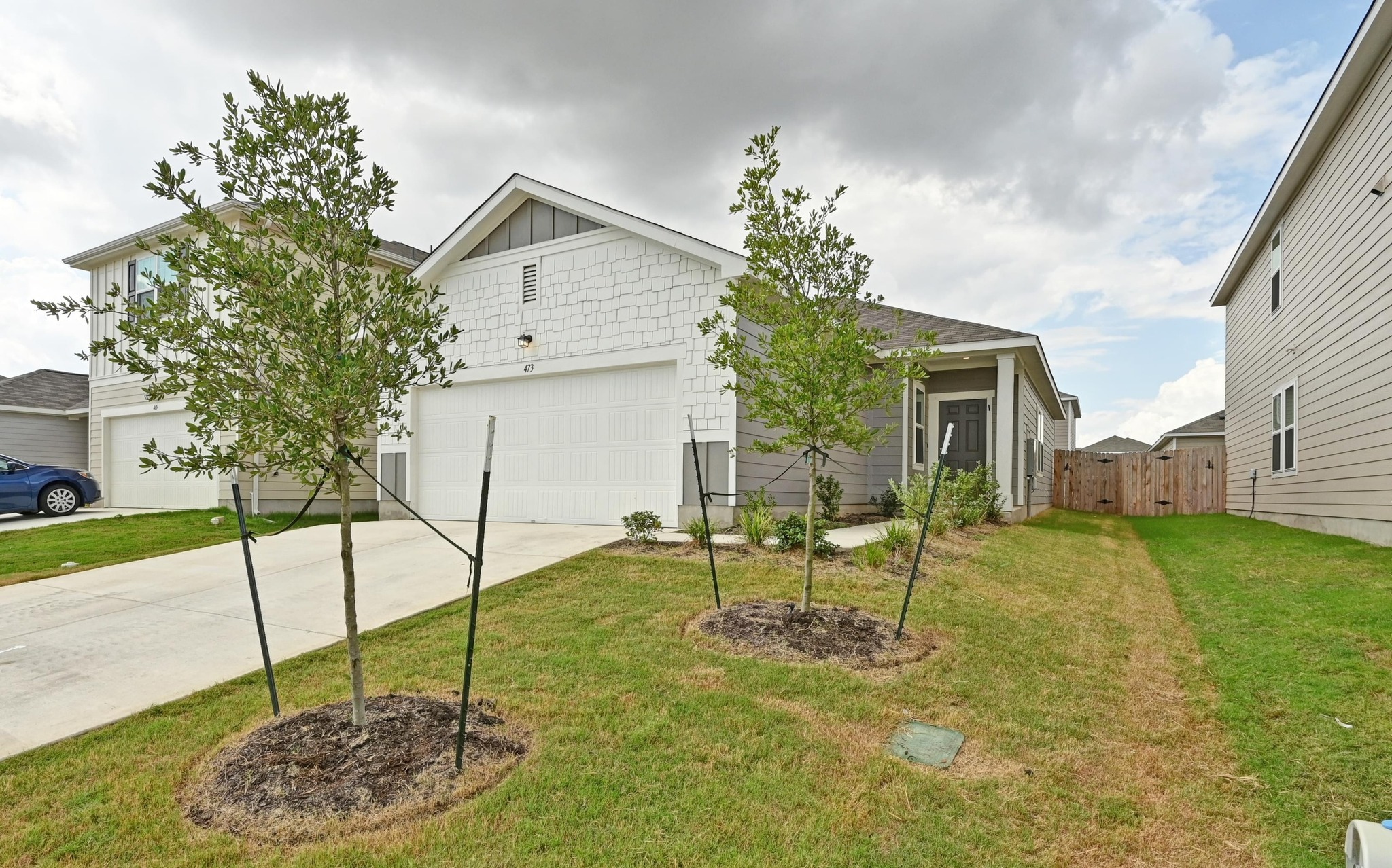 473 Thistle Lane Maxwell, TX 78656 - Photo 3 of 25 View of front of home with concrete driveway and a gate