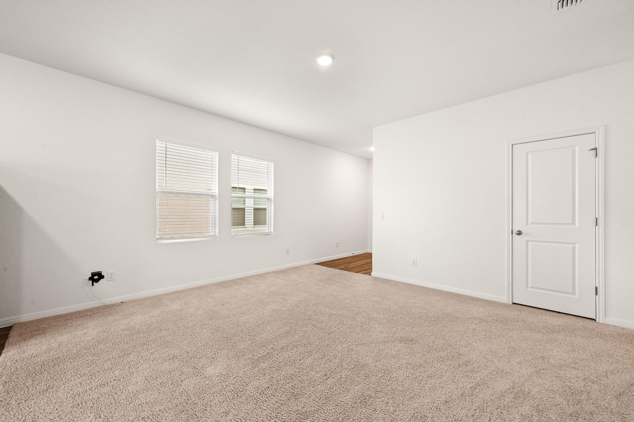 473 Thistle Lane Maxwell, TX 78656 - Photo 7 of 25 Unfurnished room with carpet flooring and recessed lighting