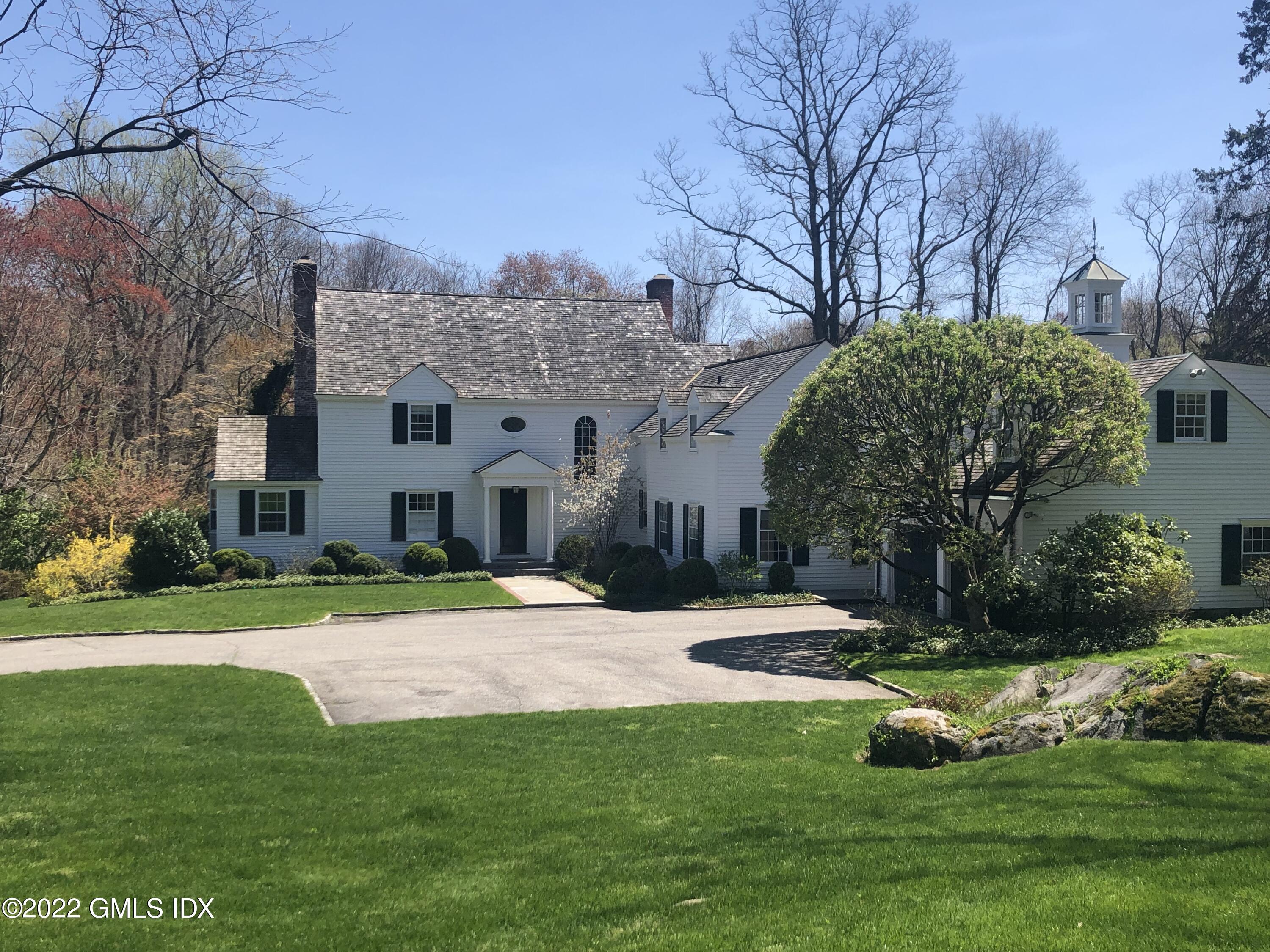 144 Pecksland Road Greenwich, CT 06831 - Photo 1 of 49 a view of a house with a yard