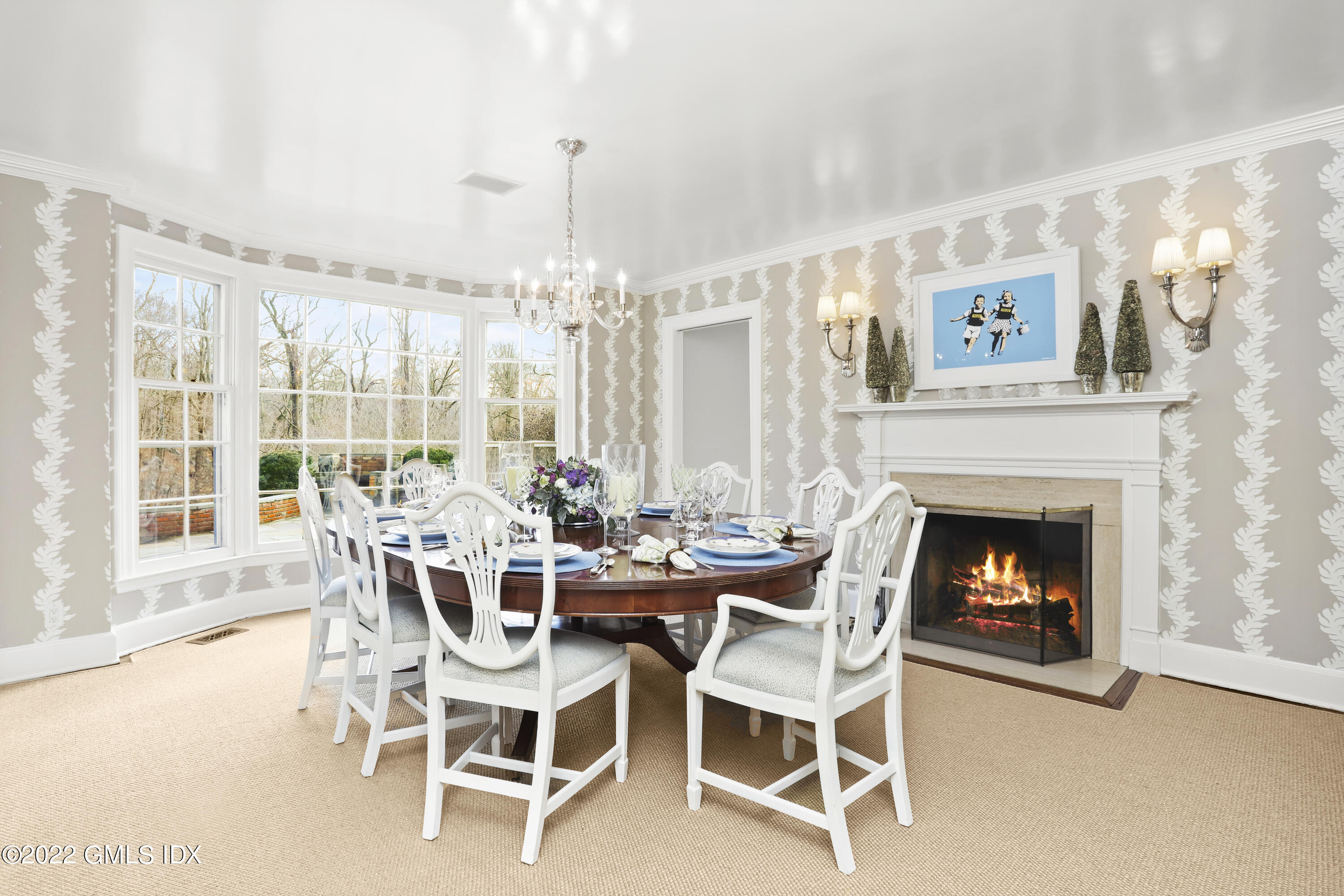 144 Pecksland Road Greenwich, CT 06831 - Photo 13 of 49 a dining room with furniture a fireplace and large windows