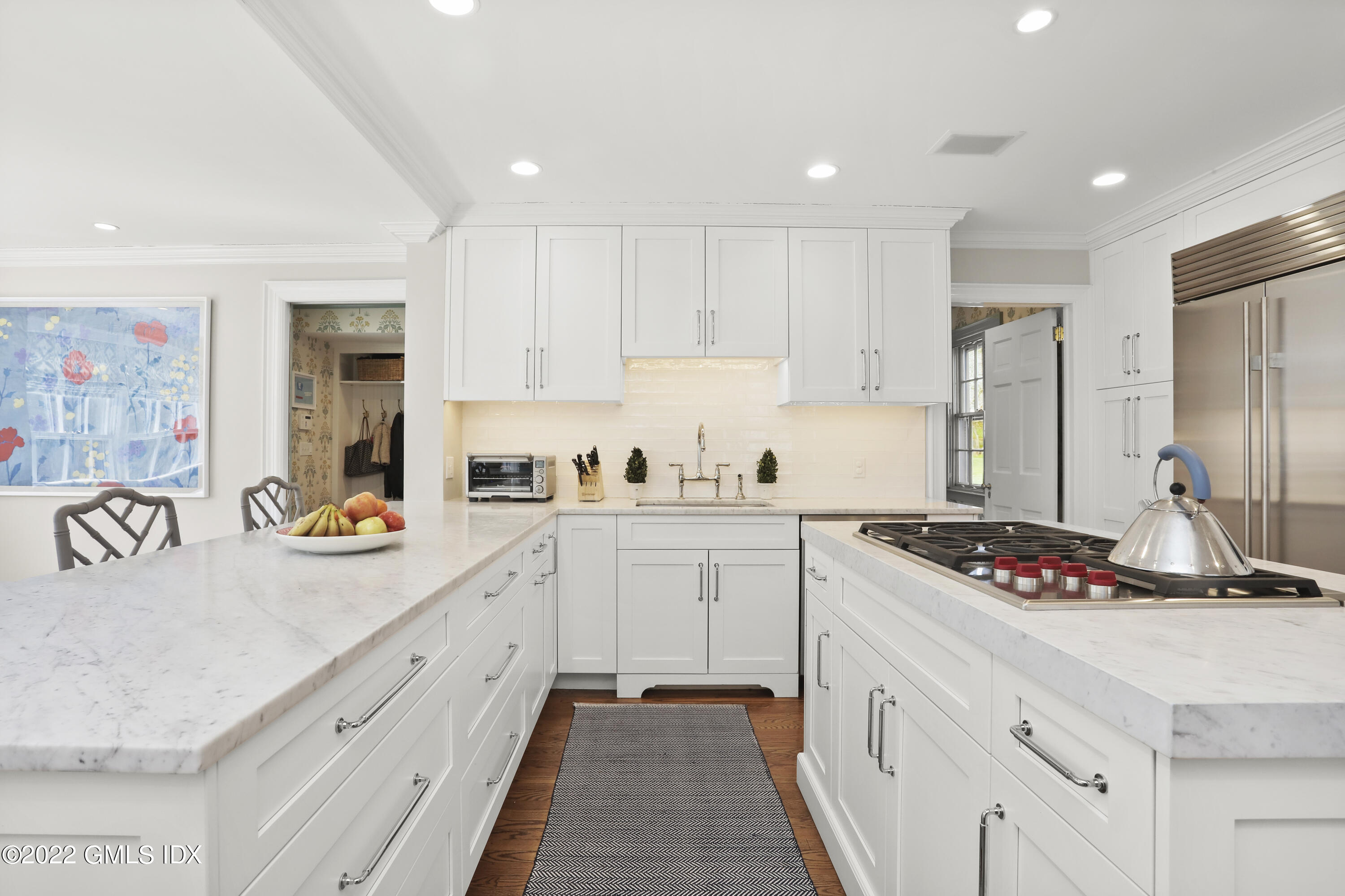 144 Pecksland Road Greenwich, CT 06831 - Photo 14 of 49 a kitchen with stainless steel appliances granite countertop a sink stove and cabinets