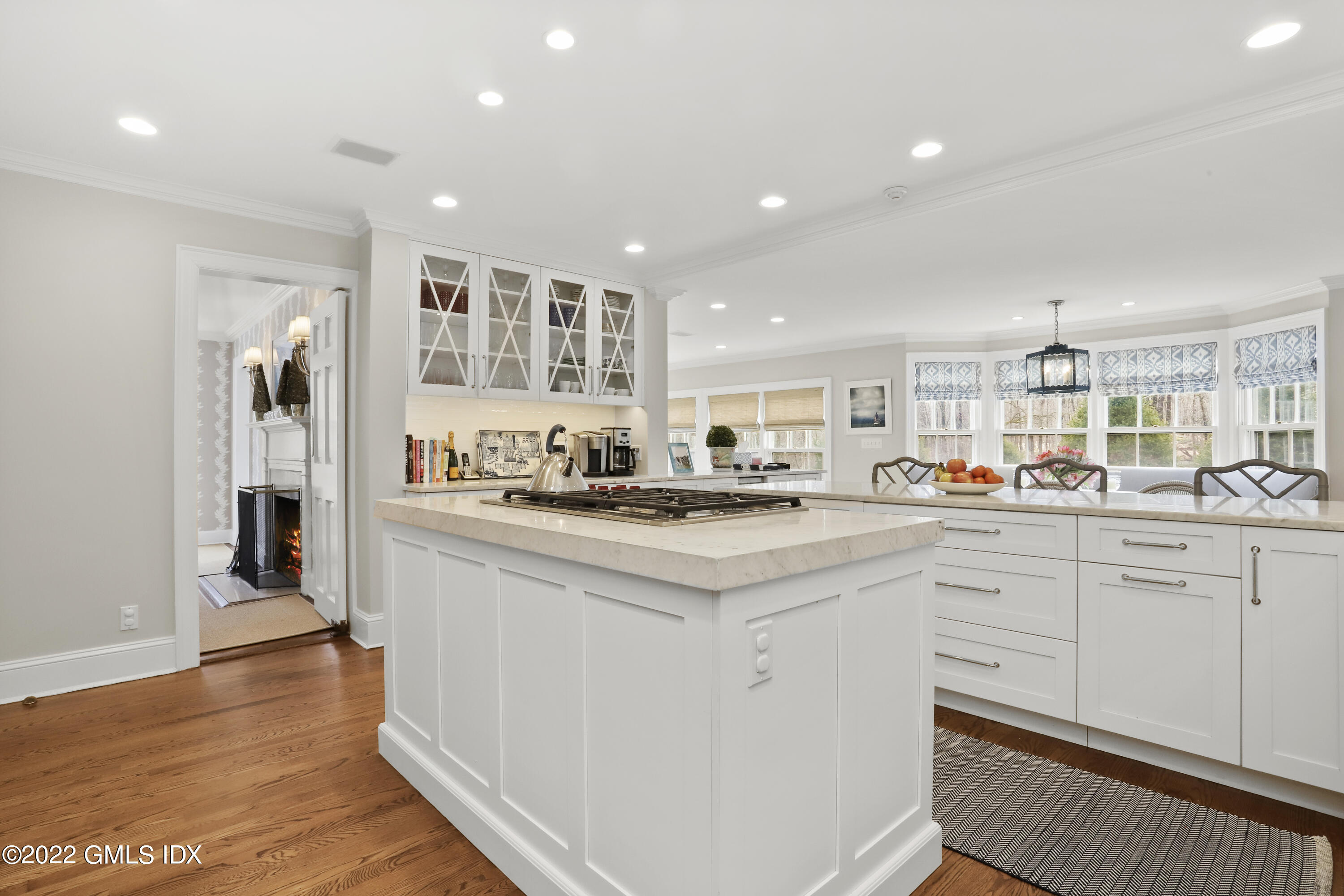 144 Pecksland Road Greenwich, CT 06831 - Photo 15 of 49 a kitchen with white cabinets and sink