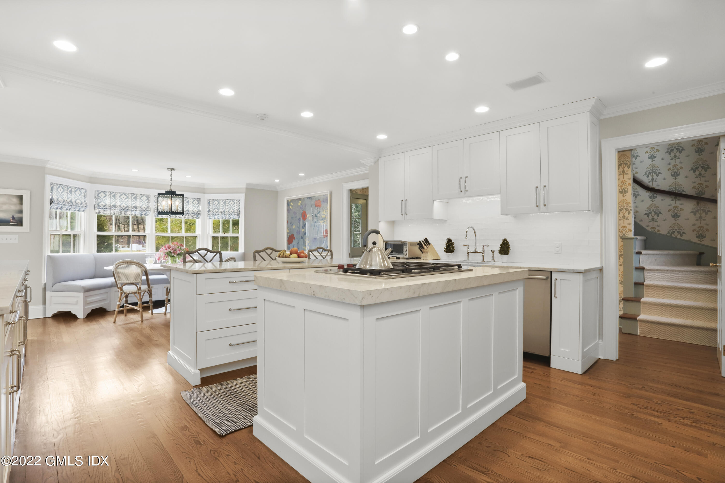 144 Pecksland Road Greenwich, CT 06831 - Photo 17 of 49 a kitchen with stainless steel appliances granite countertop a refrigerator a stove and a wooden floors