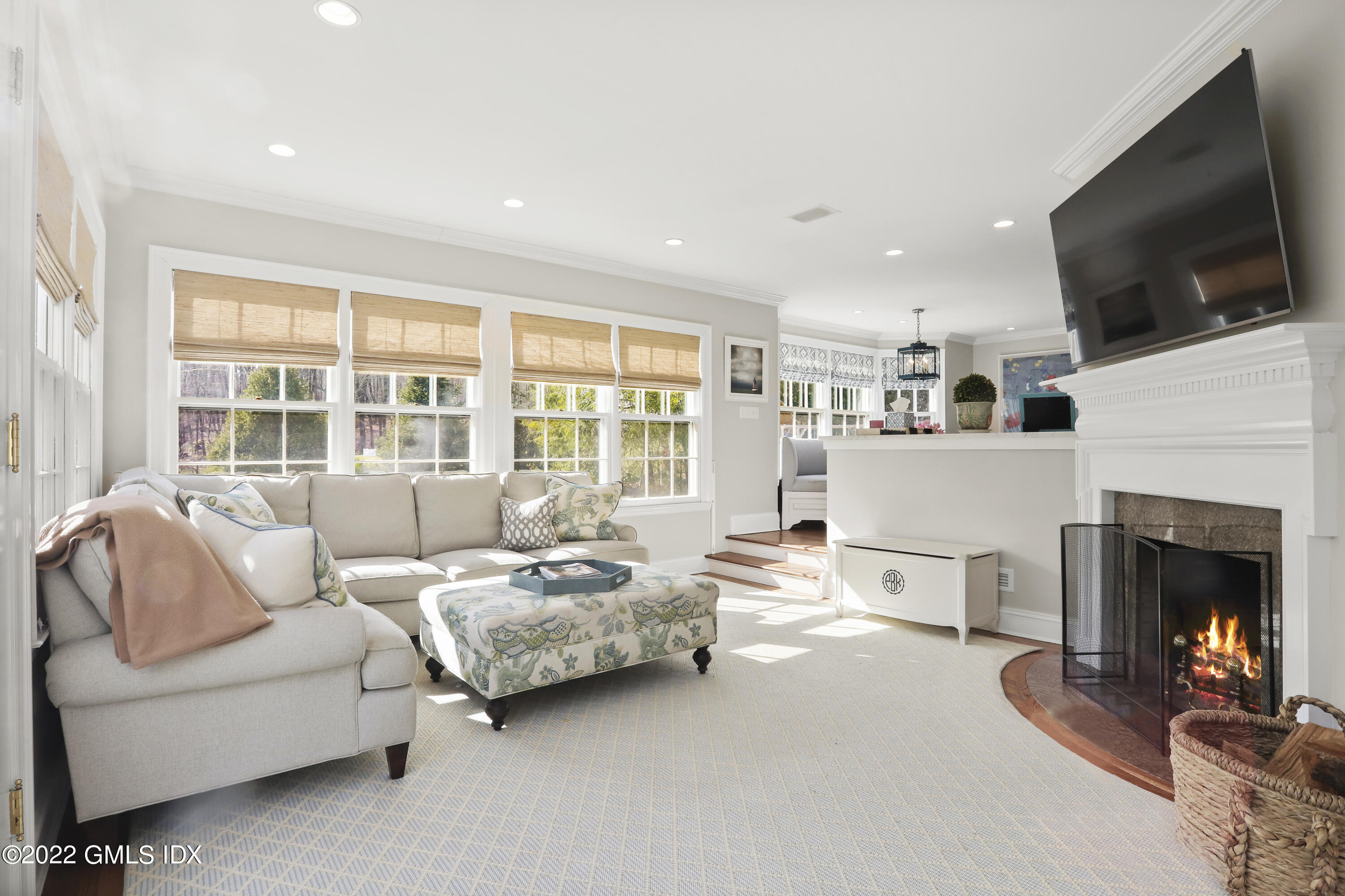 144 Pecksland Road Greenwich, CT 06831 - Photo 20 of 49 a living room with furniture fireplace and flat screen tv