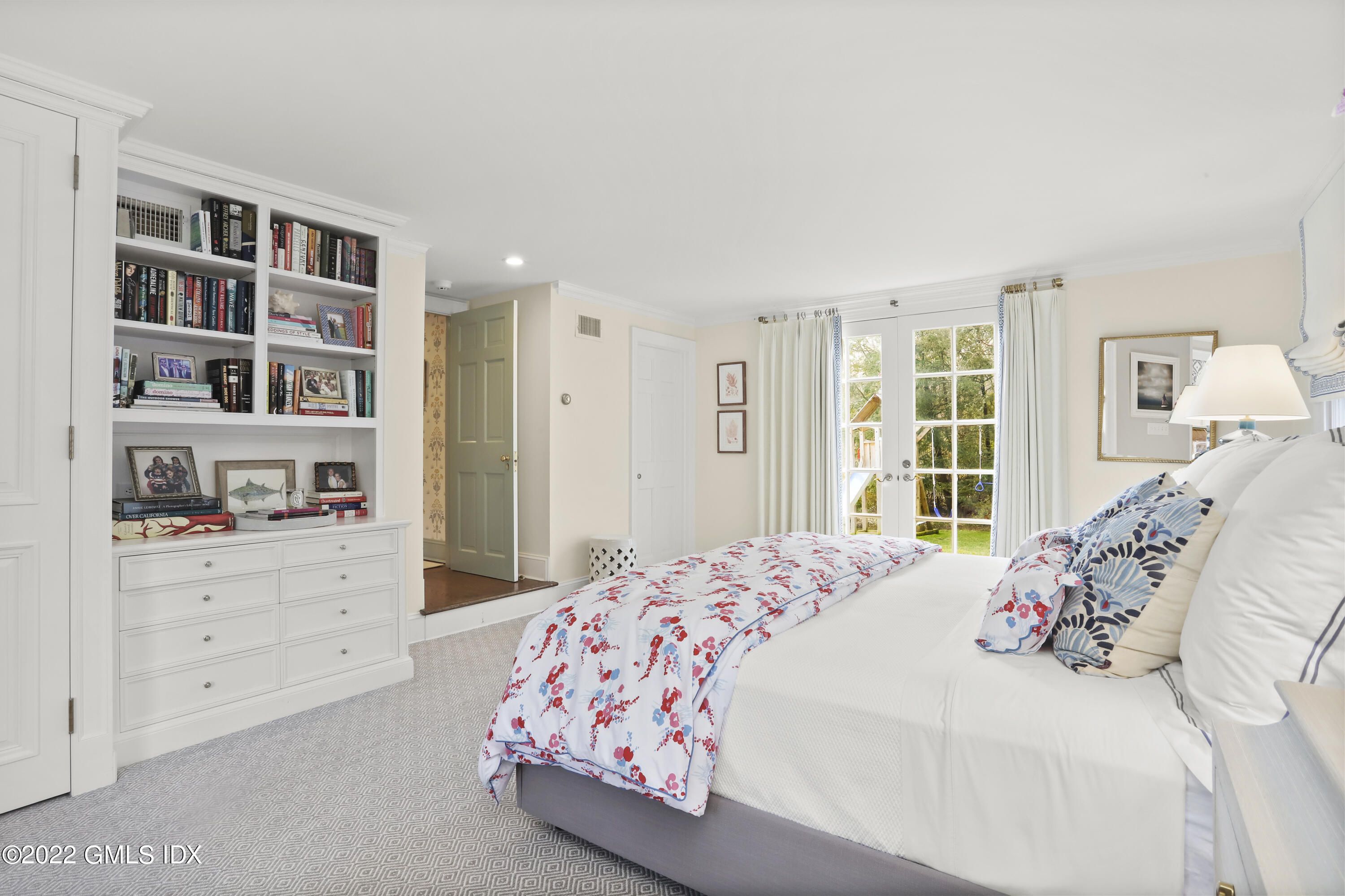 144 Pecksland Road Greenwich, CT 06831 - Photo 25 of 49 a bedroom with a bed and a cabinets