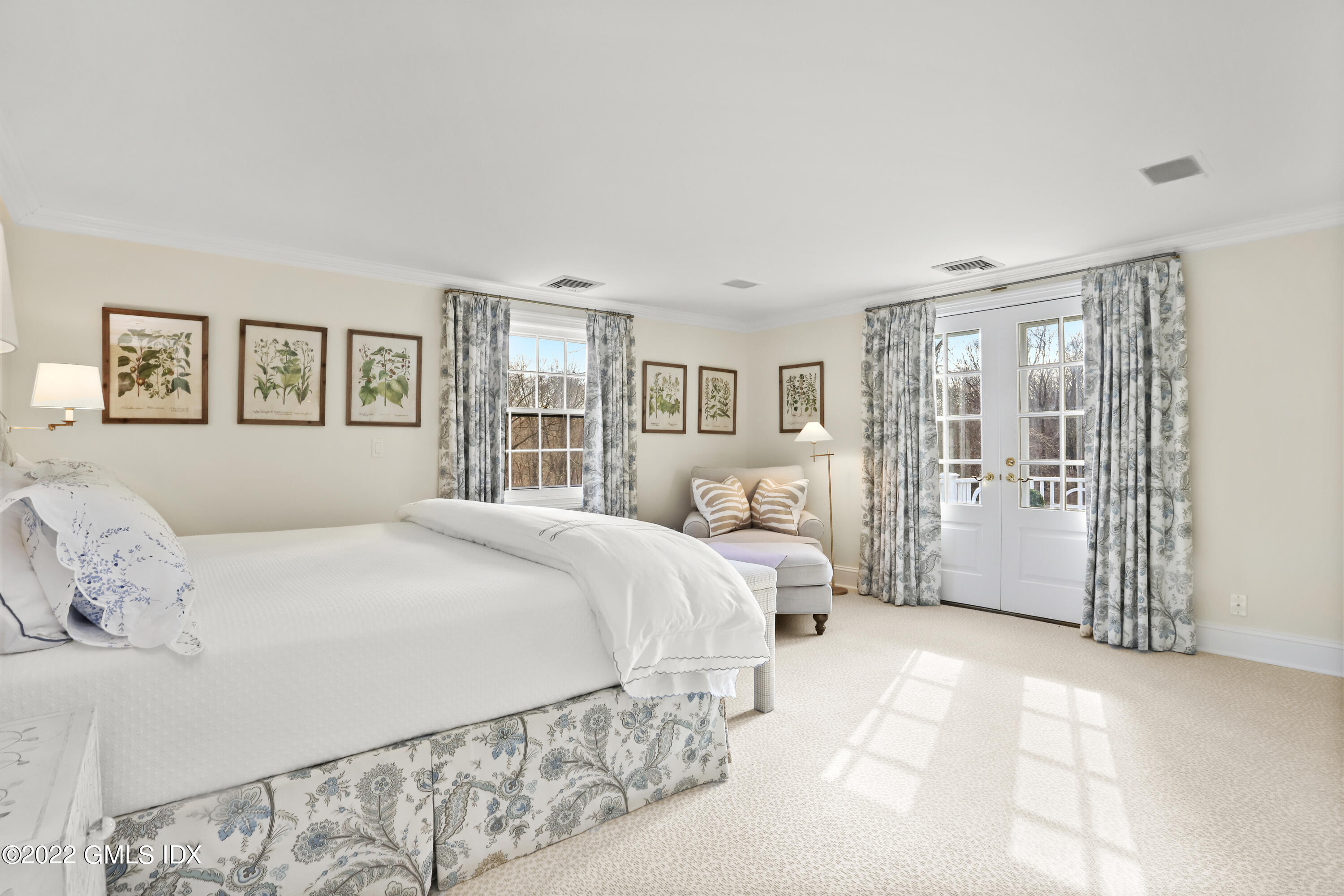 144 Pecksland Road Greenwich, CT 06831 - Photo 26 of 49 a spacious bedroom with a large bed and a window