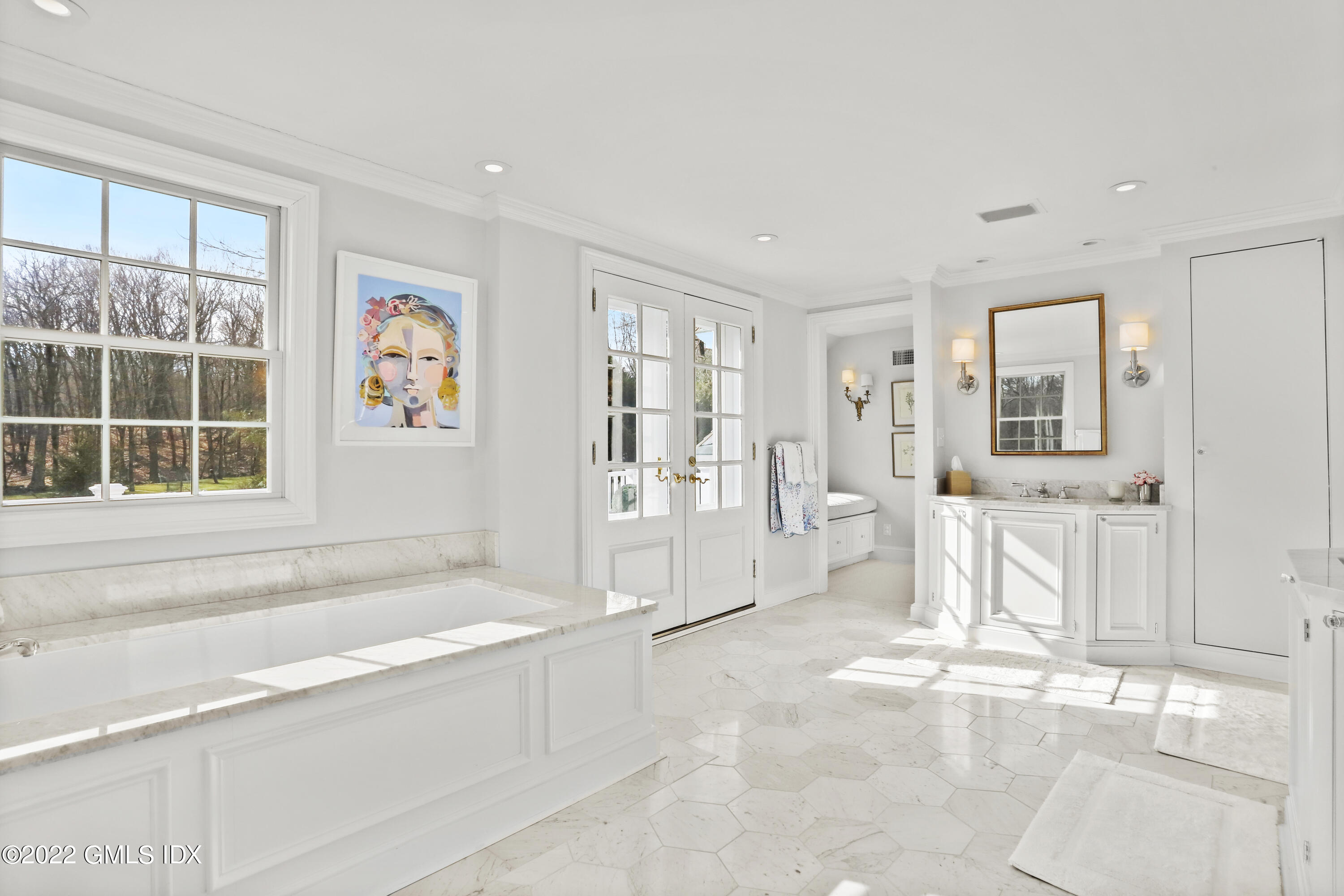 144 Pecksland Road Greenwich, CT 06831 - Photo 28 of 49 a spacious bathroom with a tub sink and mirror